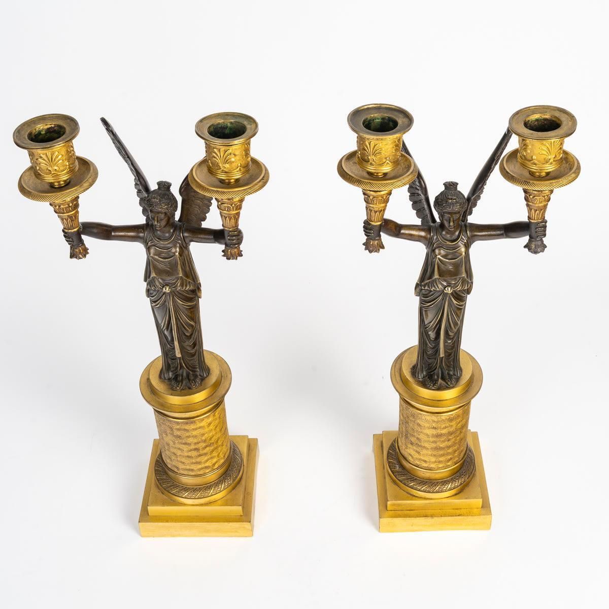 A Pair Of Gilt Bronze And Patinated Candelabra With Winged Victories. photo furniture