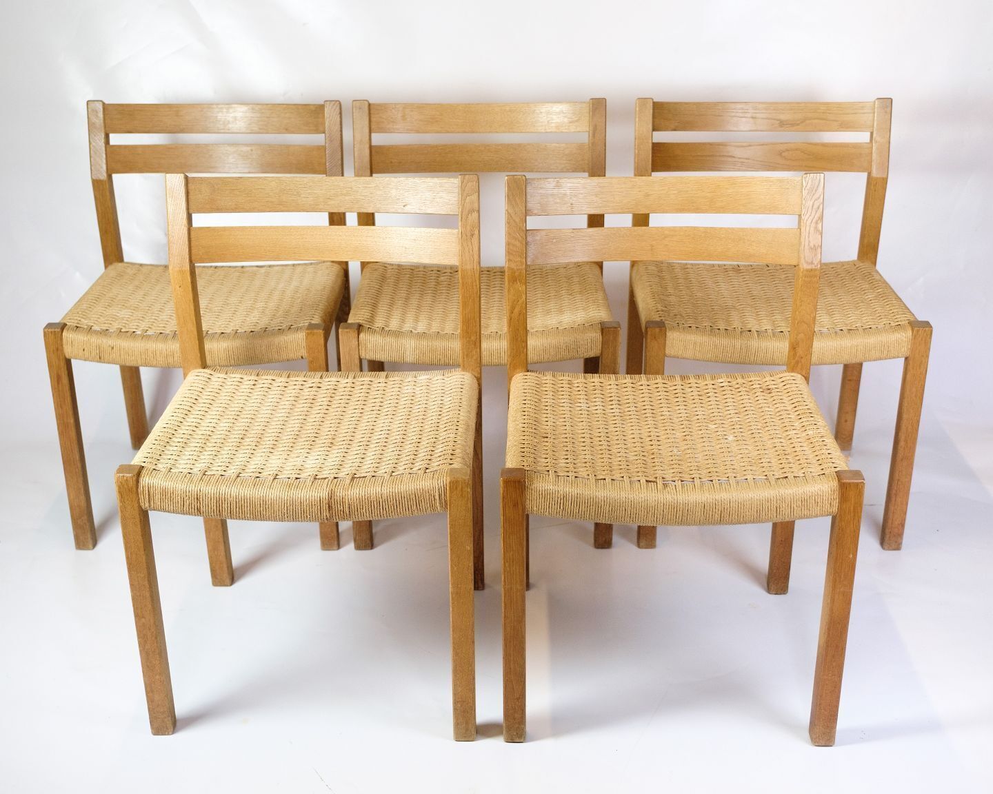 Set Of Five Dining Chairs Model 401 In Oak  & Plank Wicker By Jørgen Henrik Møller For Jl Møllers Furniture Factory  From 1960s