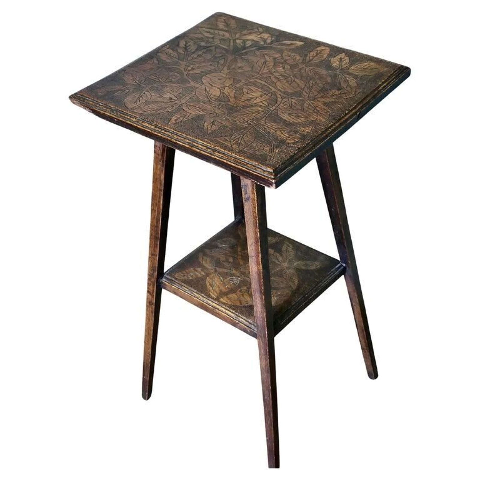 An Edwardian Carved Oak Etagere Or Occasional Table