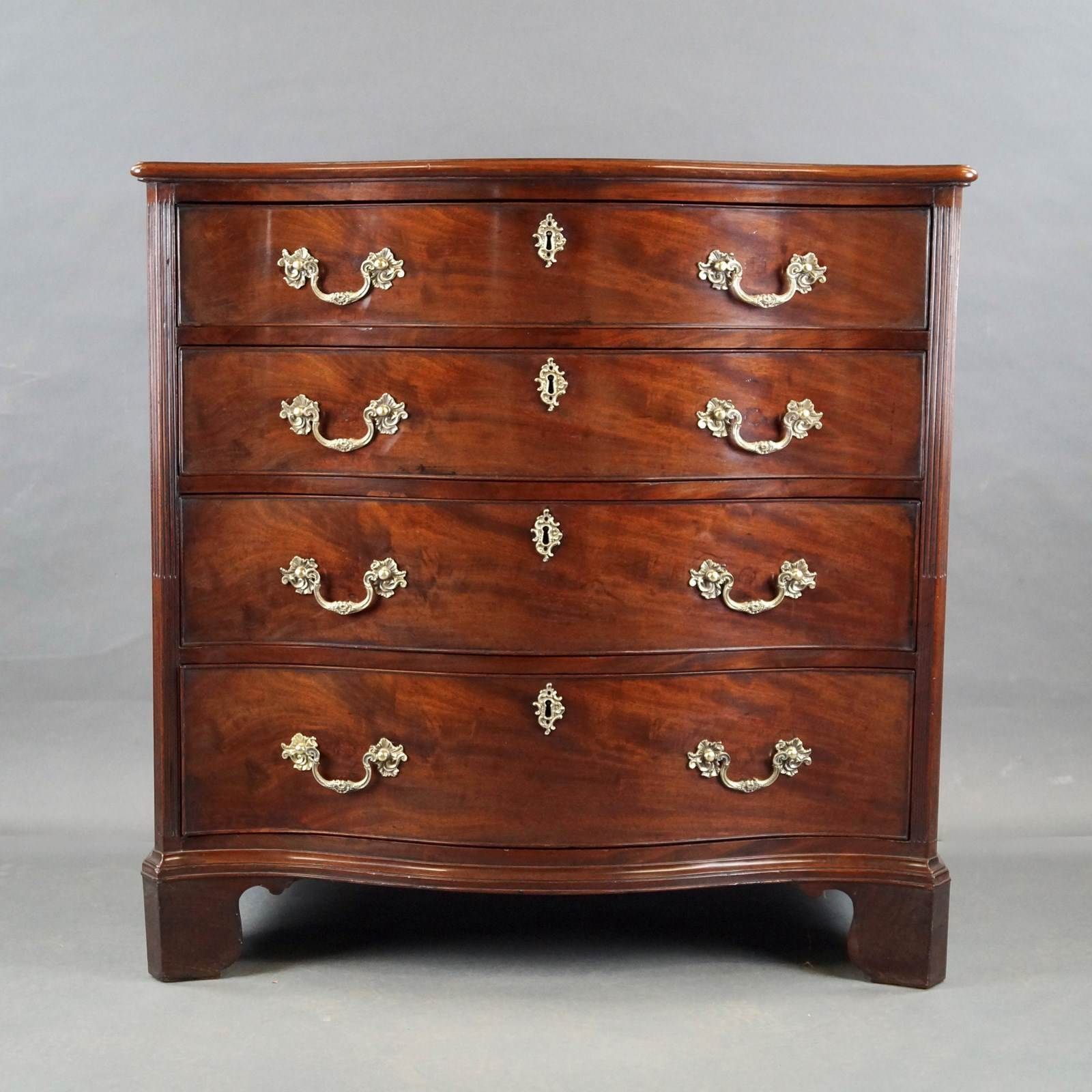 A George III Serpentine Chest Of Drawers photo Furniture