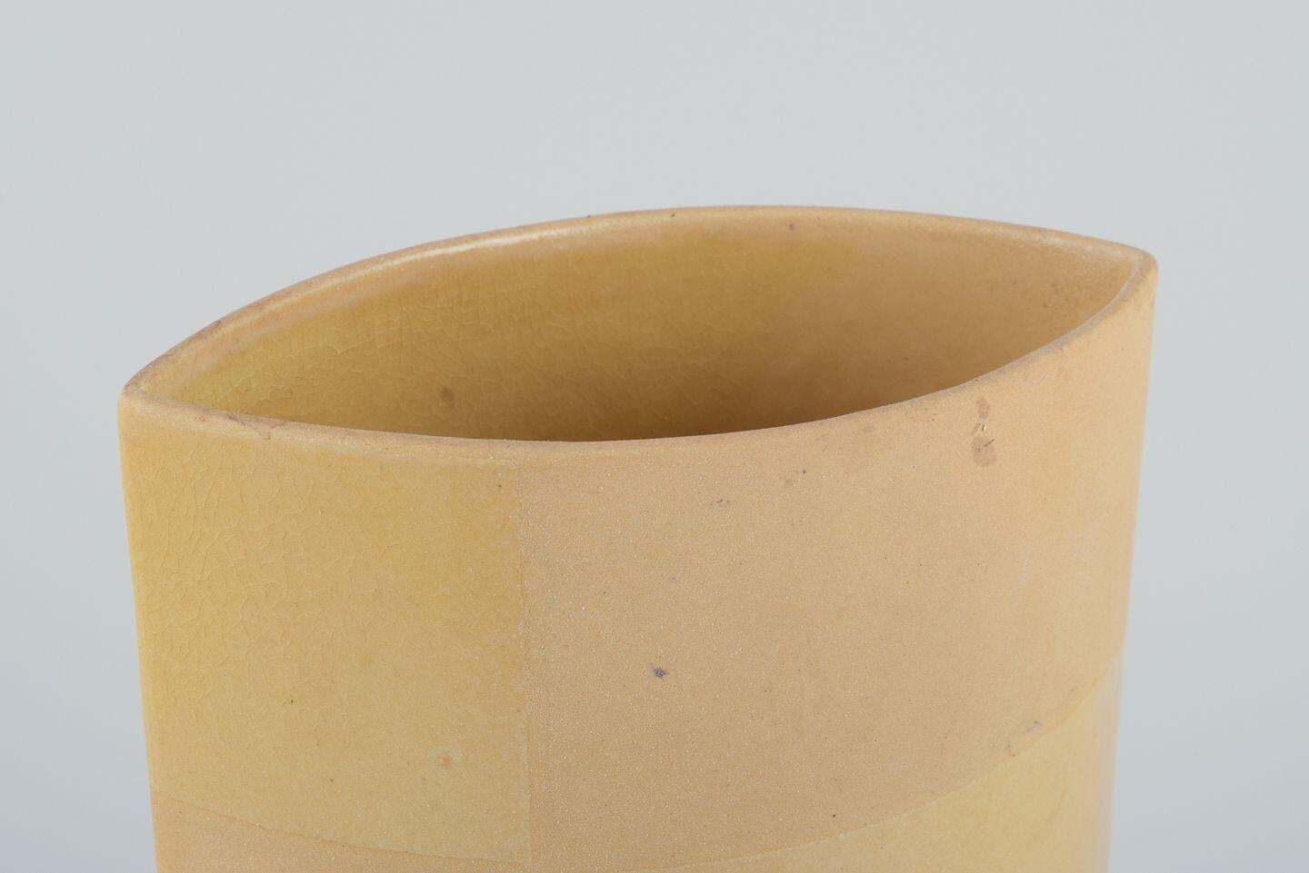 European Studio Ceramicist. Ceramic Vase With Yellow Glaze. 1980s photo Home Decor