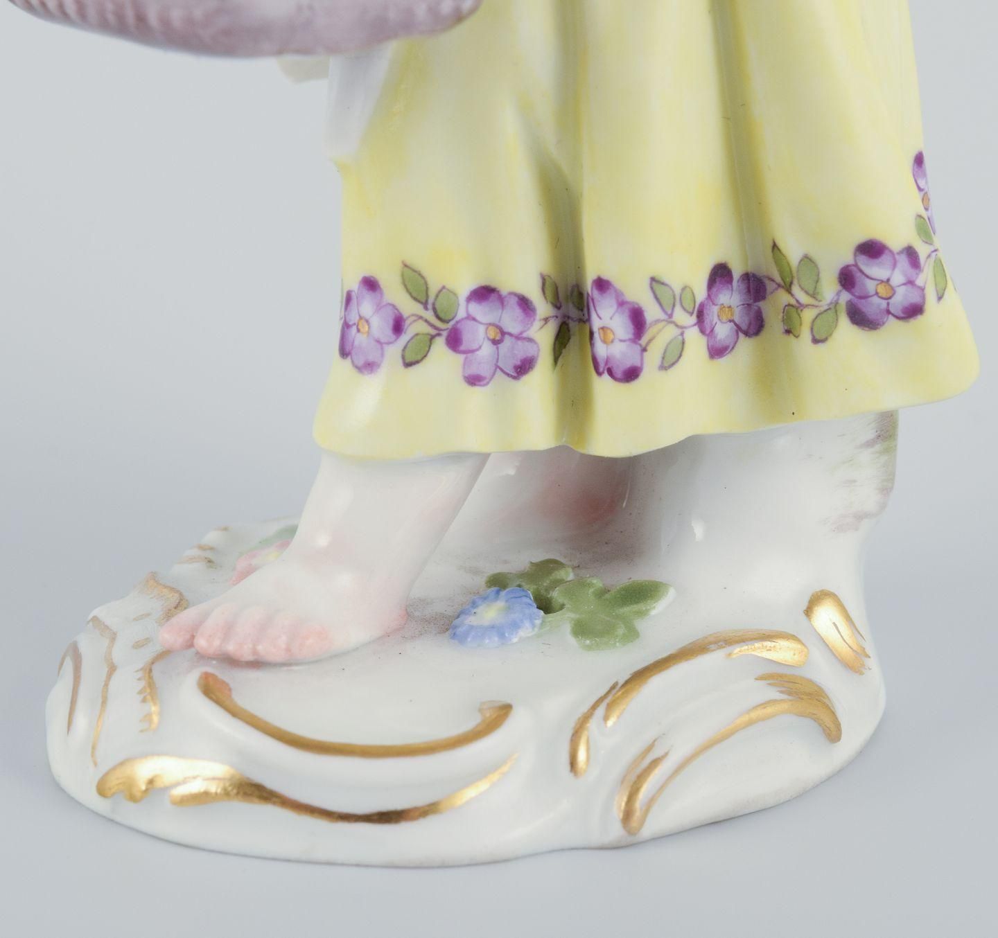 Meissen, Germany. Porcelain Figurine Of Girl With Basket. Ca 1900 photo vinterior