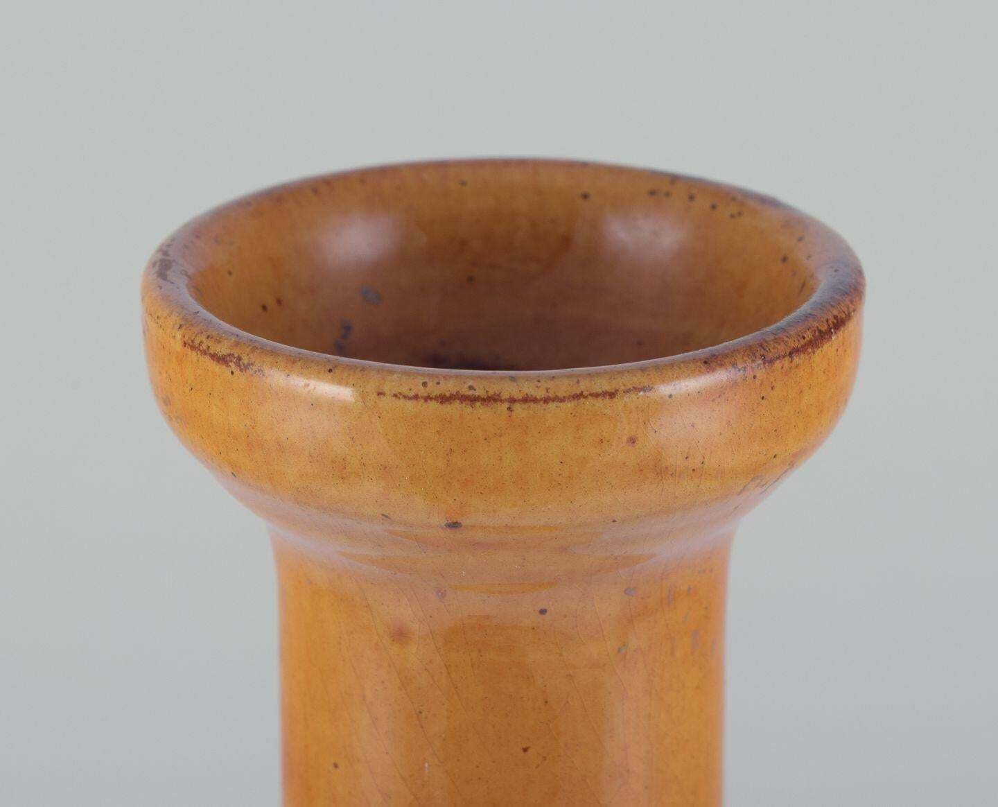 Biot, France. Unique Floor Vase In Ceramic With Narrow Neck. Ochre Yellow Glaze. photo furniture