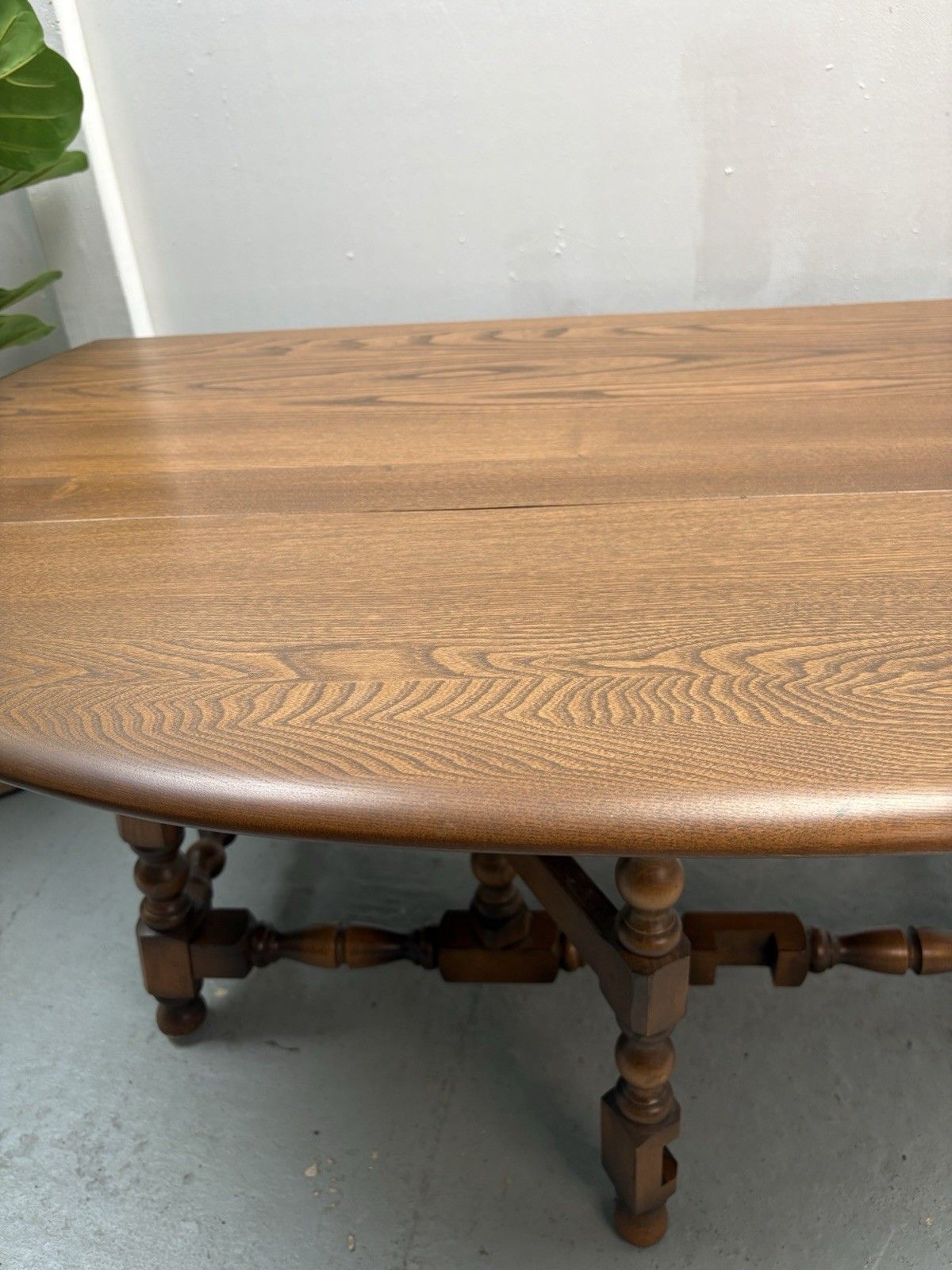 photo furniture Ercol Trinity Solid Elm 2 Tier Drop Leaf Coffee Table In Golden Dawn