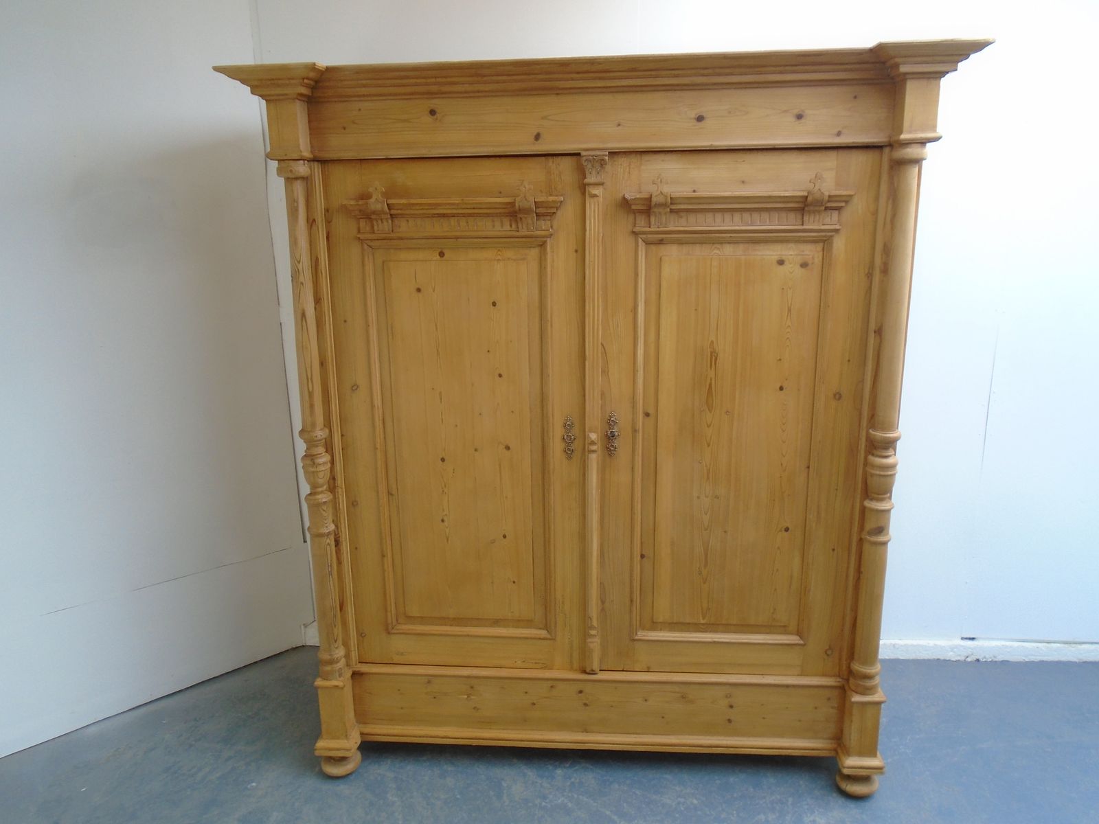 A Fantastic Large Columned Pine Waxed Victorian Knockdown Wardrobe photo furniture