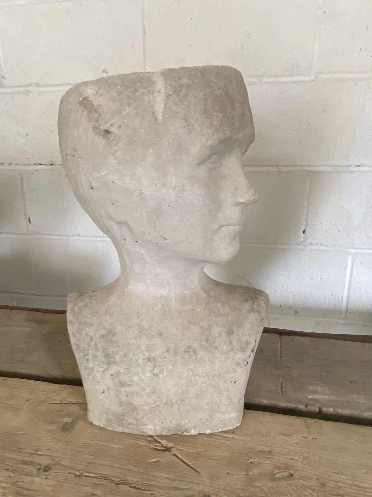 A Garden Sculpture Of Head. photo Garden Decor