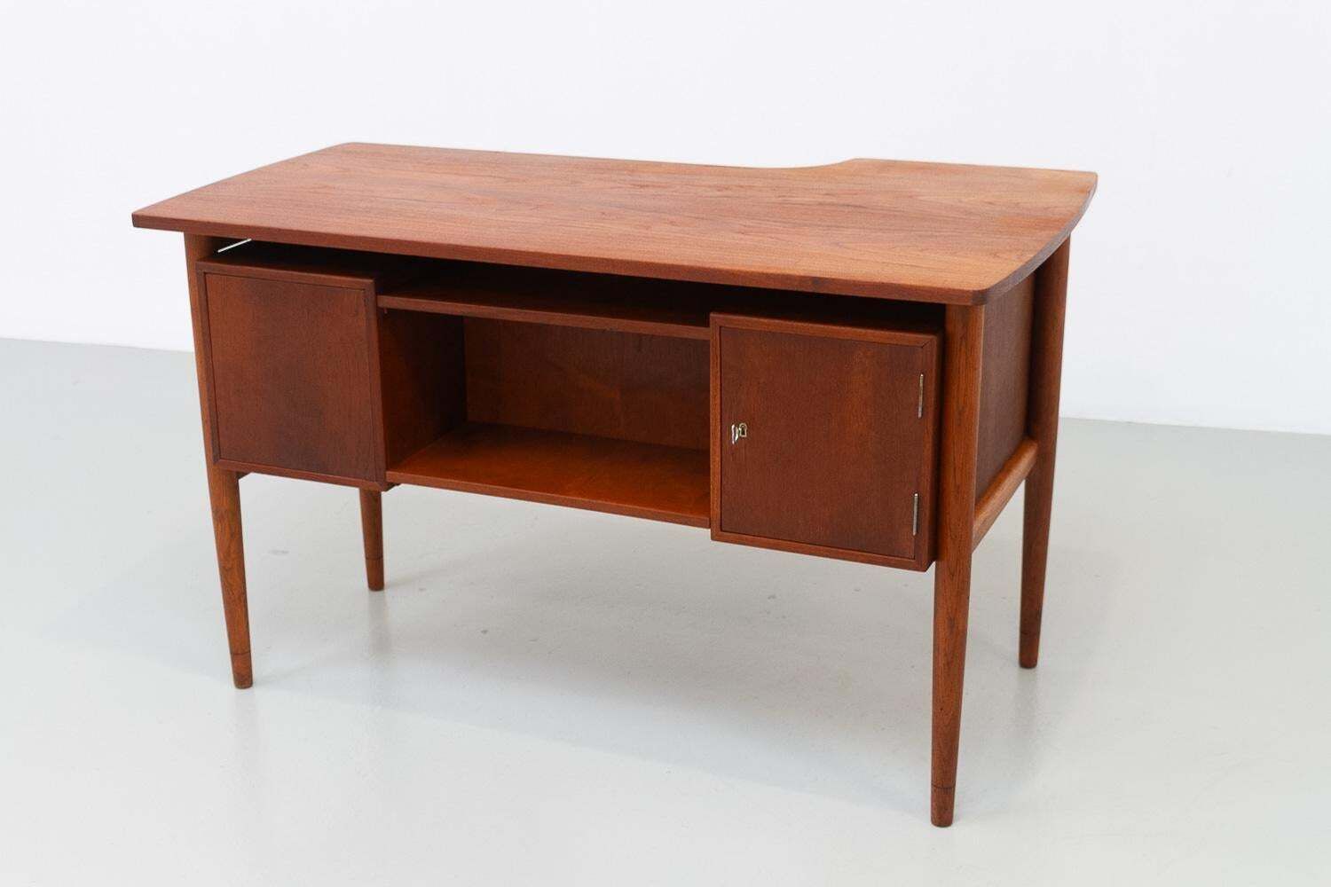 photo for sale Danish Mid Century Modern Asymmetrical Teak Desk, 1950s.
