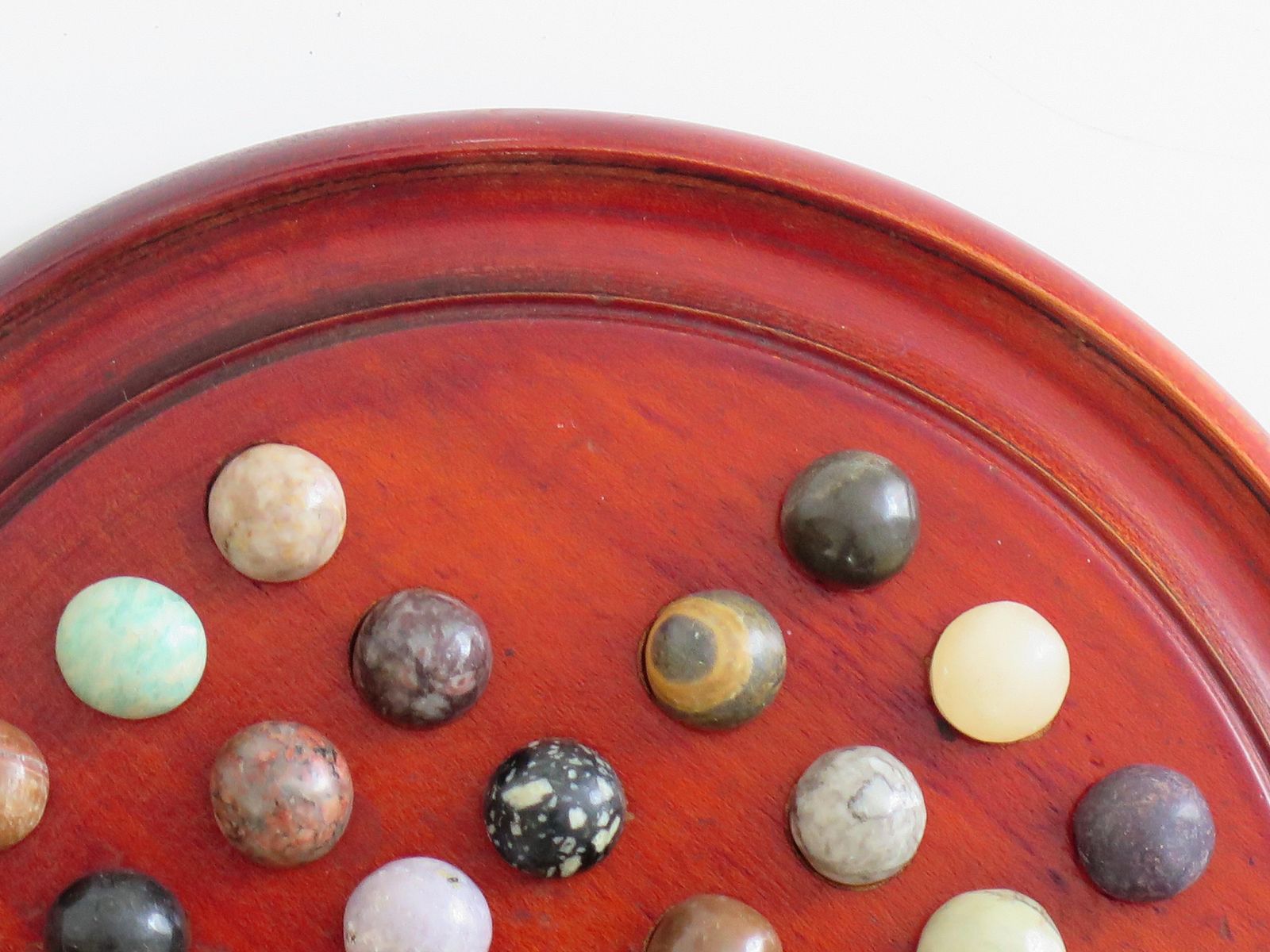 Marble Solitaire Game With Hardwood Board And 33 Agate Stone Marbles, Circa 1925 photo vinterior