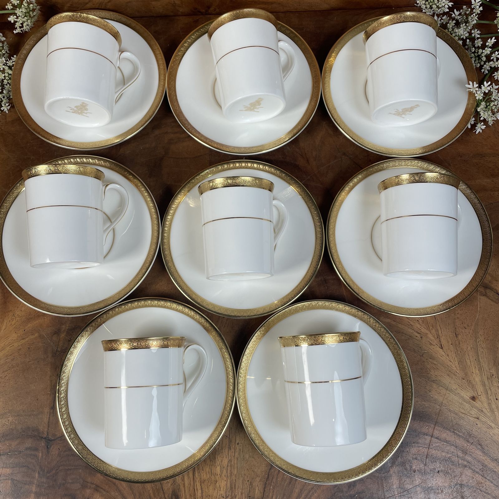 A Set Of 9 Coffee Cups And Saucers