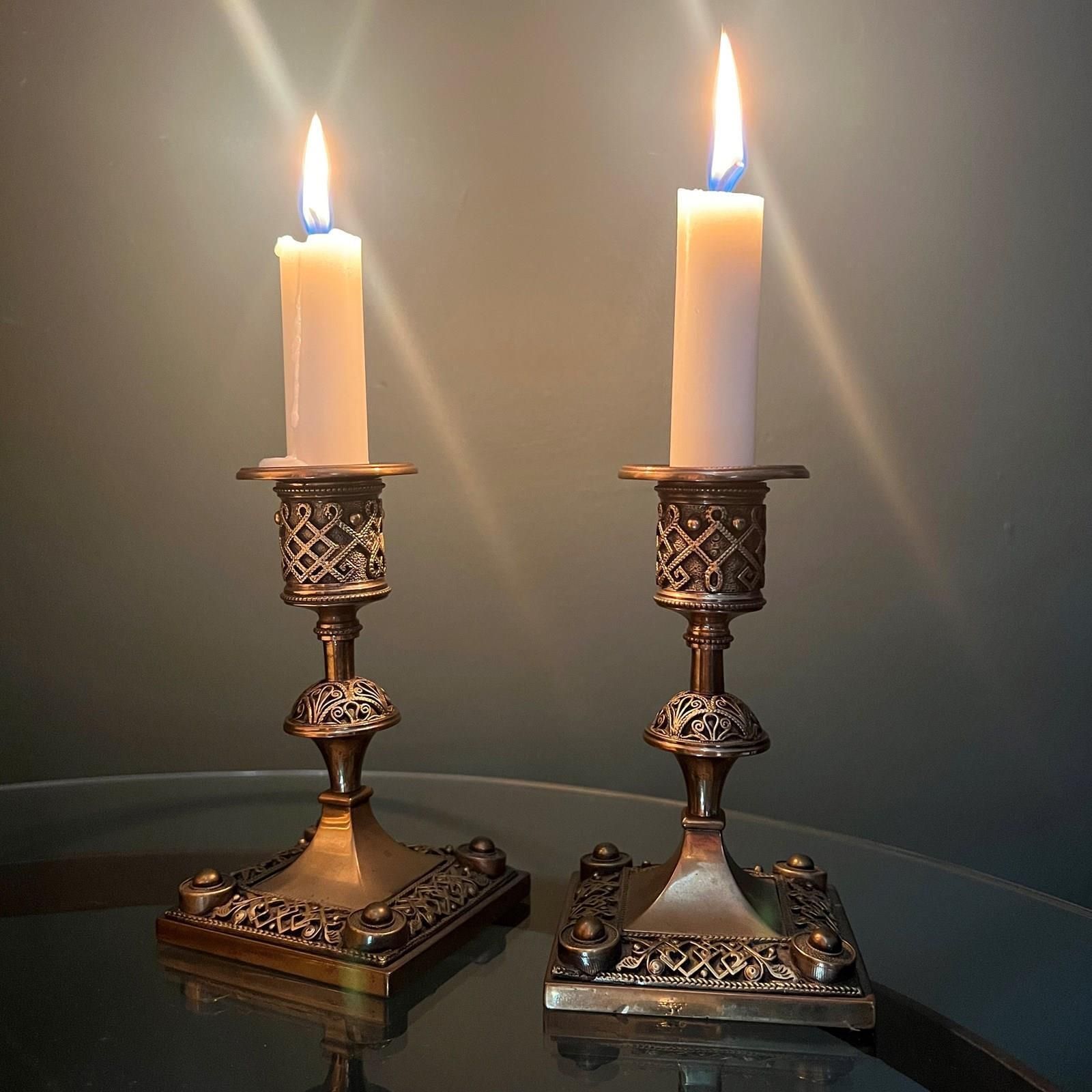 A Pair Of Late Victorian Aesthetic Brass Candlesticks