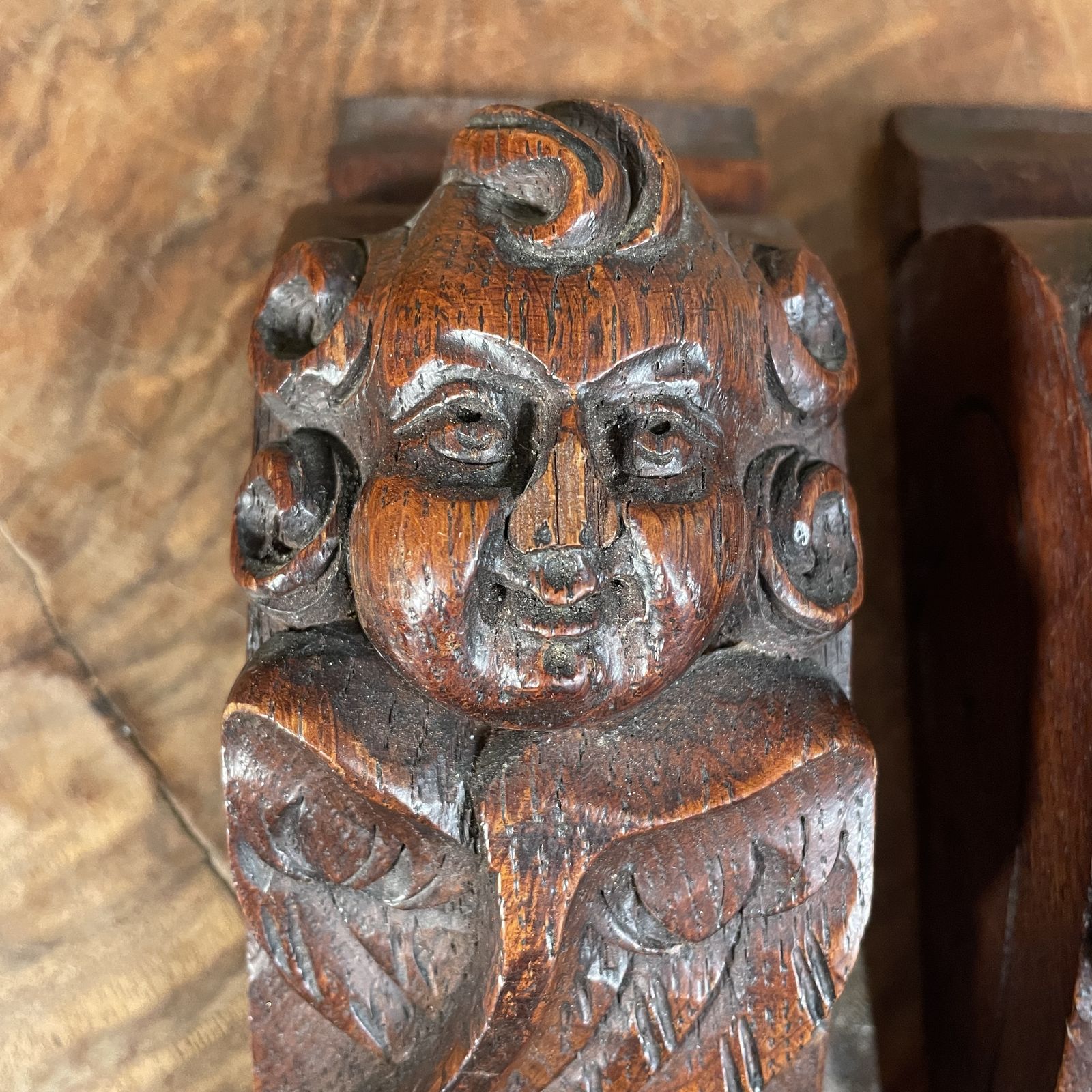 A Pair Of Carved Wooden Cherub Heads photo for sale