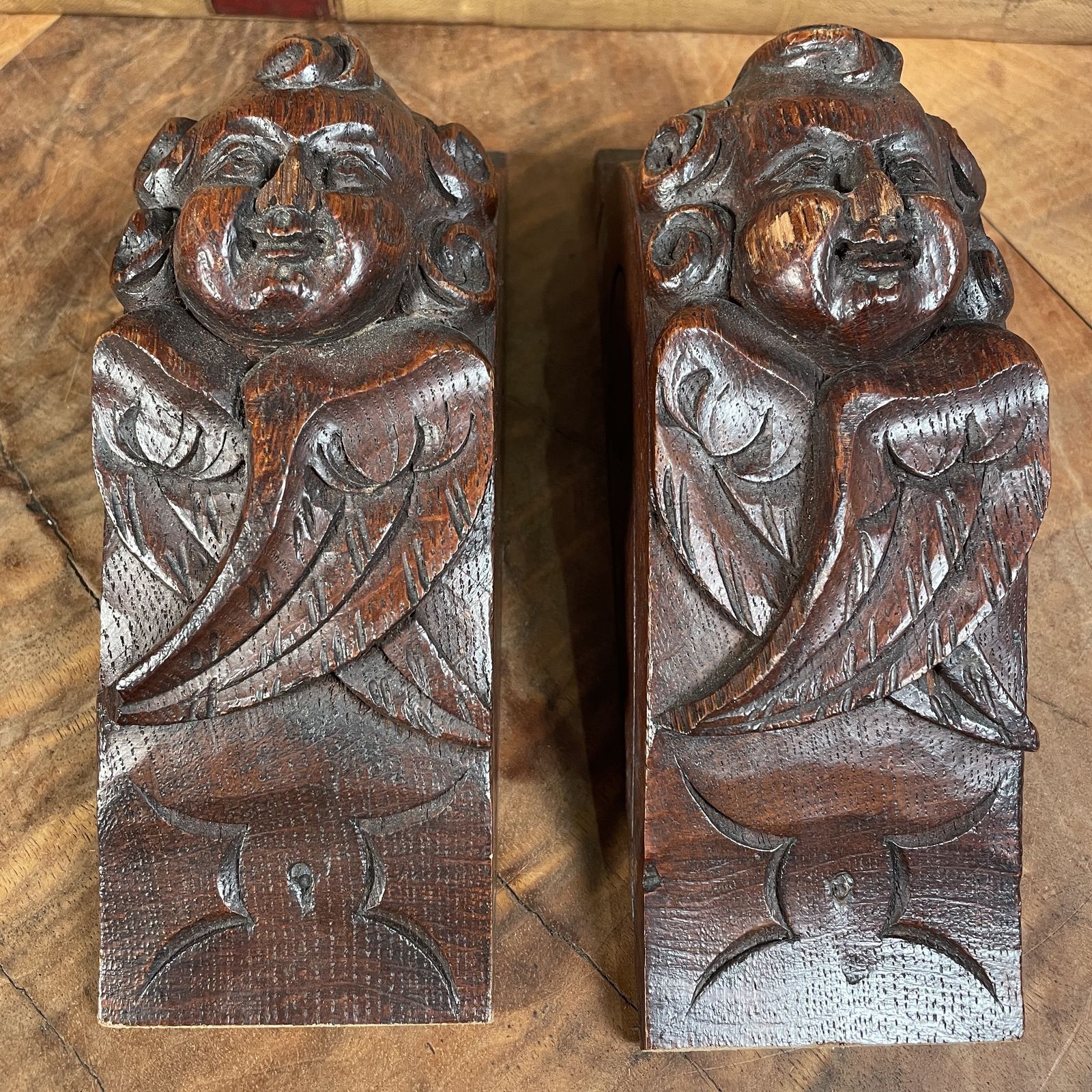 A Pair Of Carved Wooden Cherub Heads photo Home Decor