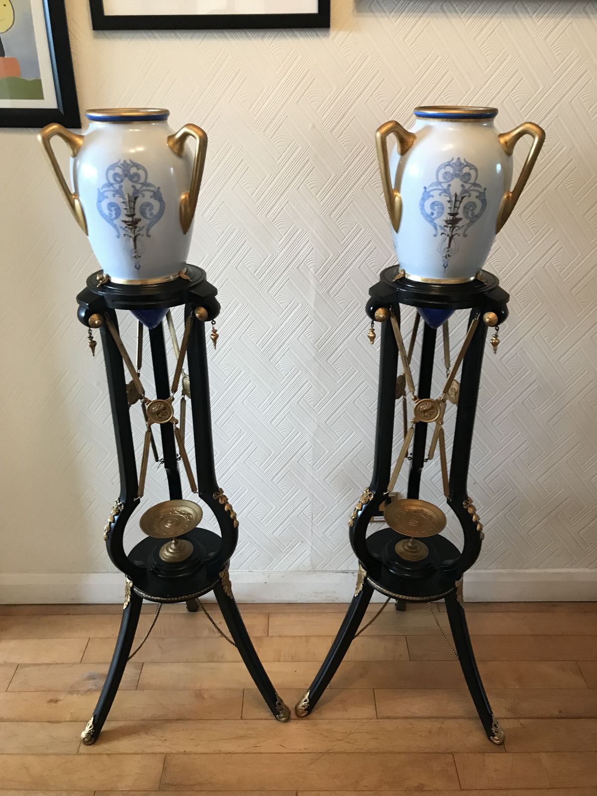 Pair Ebonised And Gilt Metal French Empire Style Athenienne Stands With Porcelain Amphora Vases photo for sale