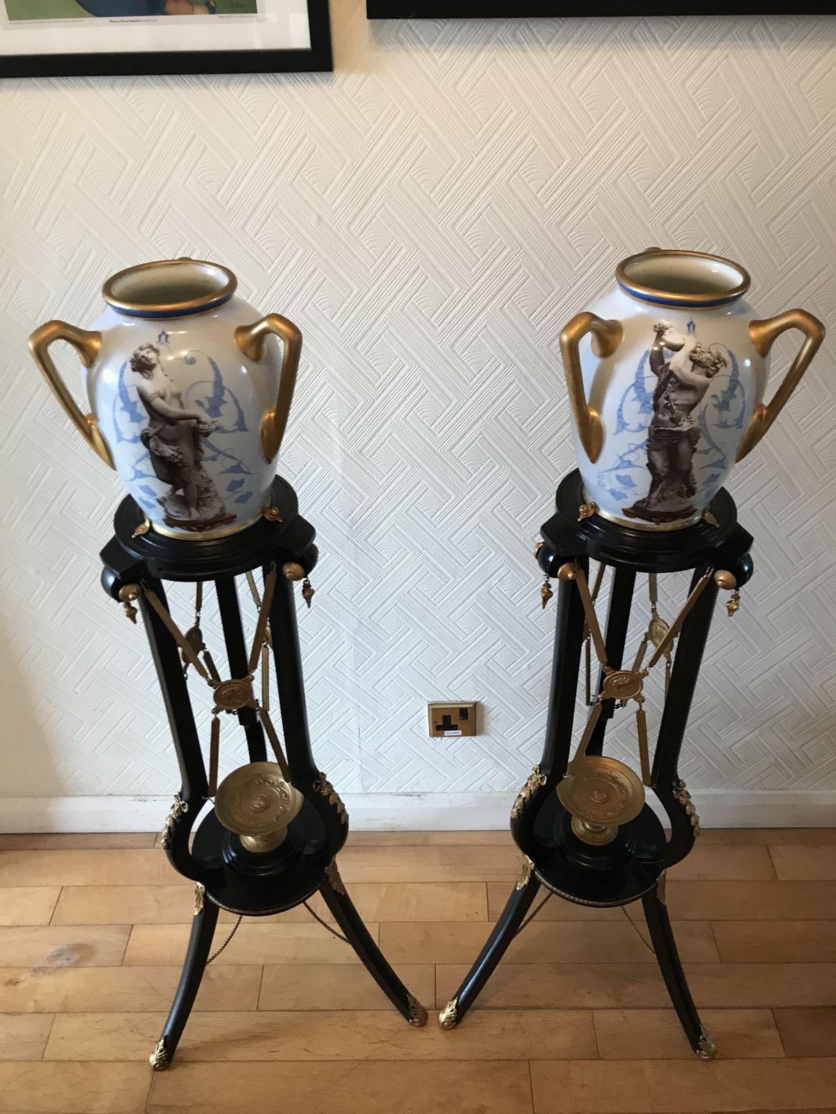 600.0 Pair Ebonised And Gilt Metal French Empire Style Athenienne Stands With Porcelain Amphora Vases photo