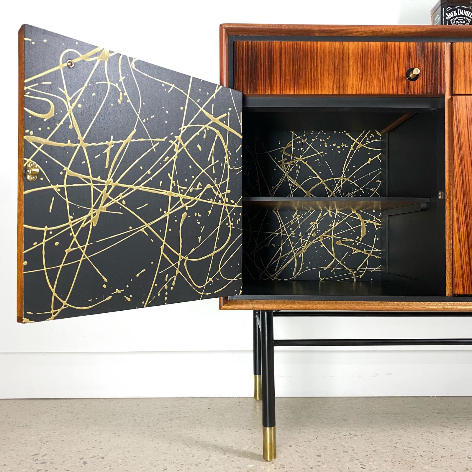 Mid Century Cocktail Bar Drinks Cabinet By Heal's In Rosewood And Brass With Black & Gold Jackson Pollock Paint Effect photo vinterior