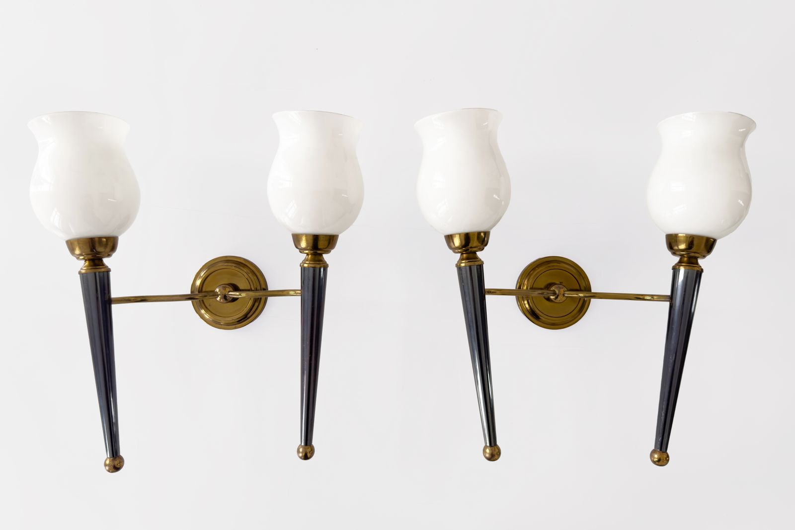 Attributed To The House Of Jansen, Pair Of Two Light Sconces In Gilded & Blue Toned Metal With Opaline Shades.