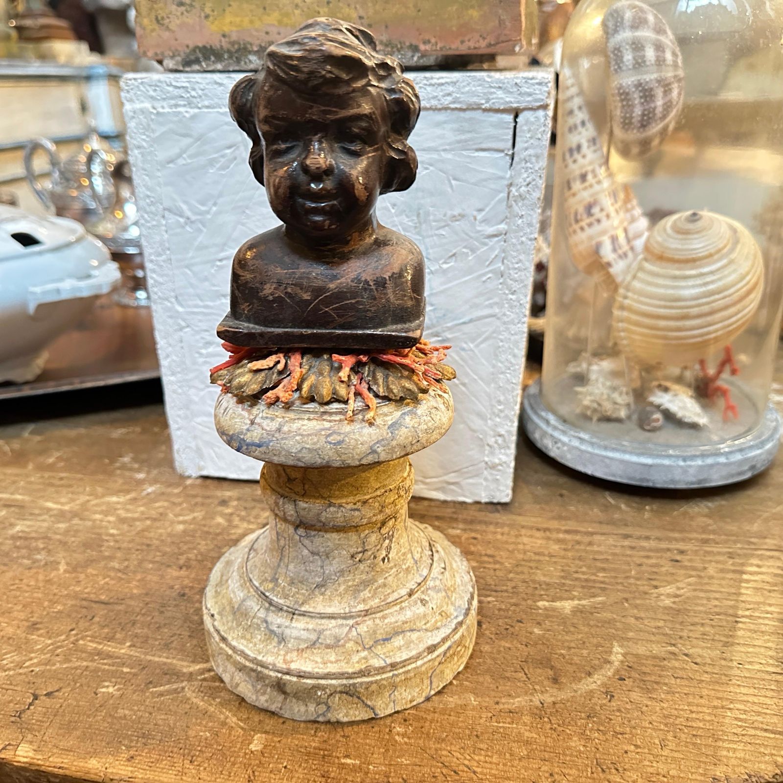 photo furniture A Baroque Revival Wood Bust Of A Putto On A Fake Marble Lacquered Wood Base
