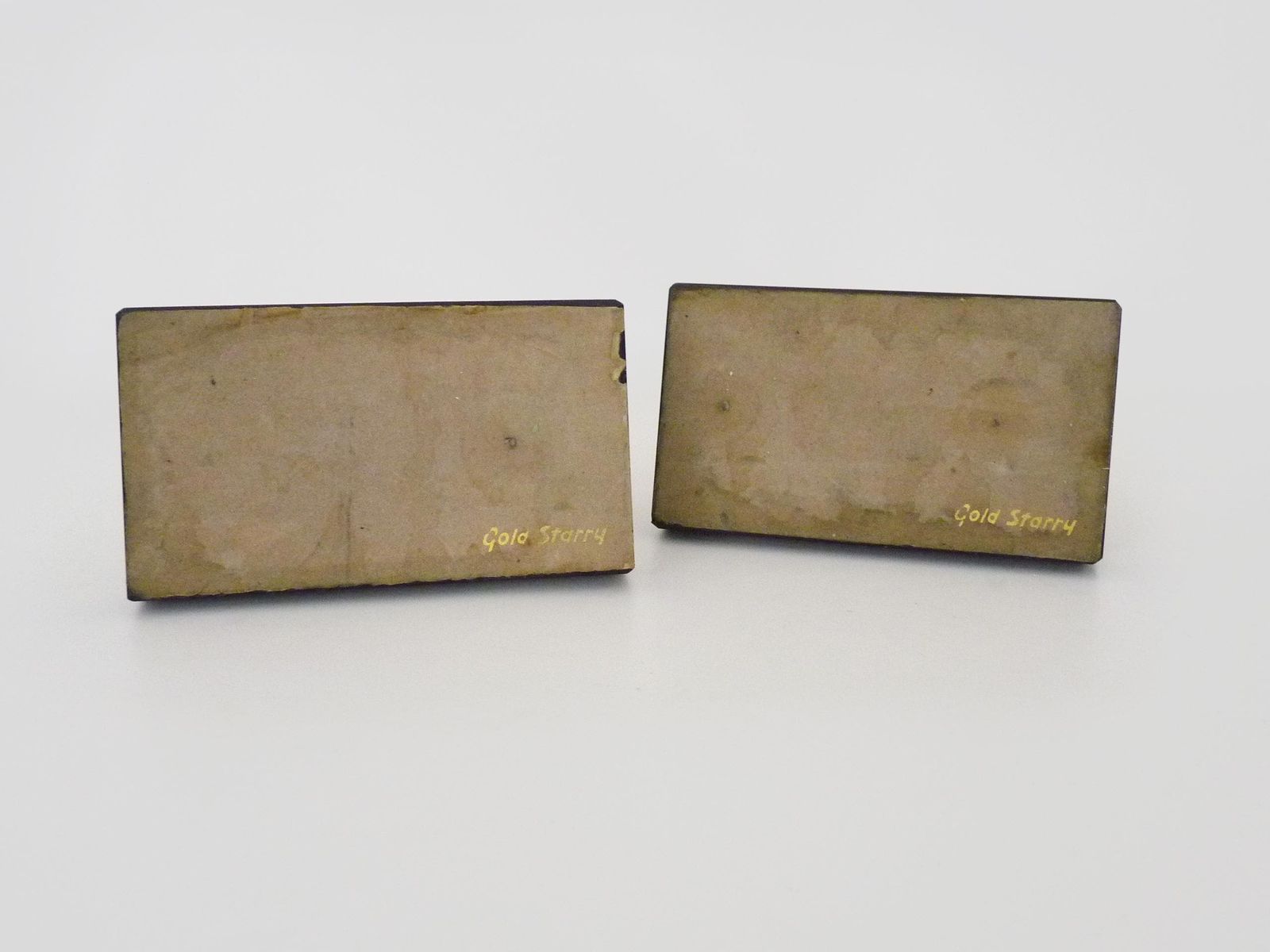 Pair Of Modernist Art Deco Gold Starry Bookends On A Black Marble Base. photo vintage