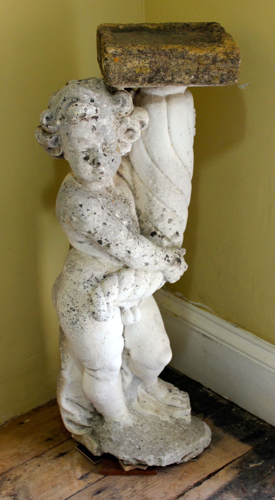 Statue Of A Boy Holding A Bird Bath