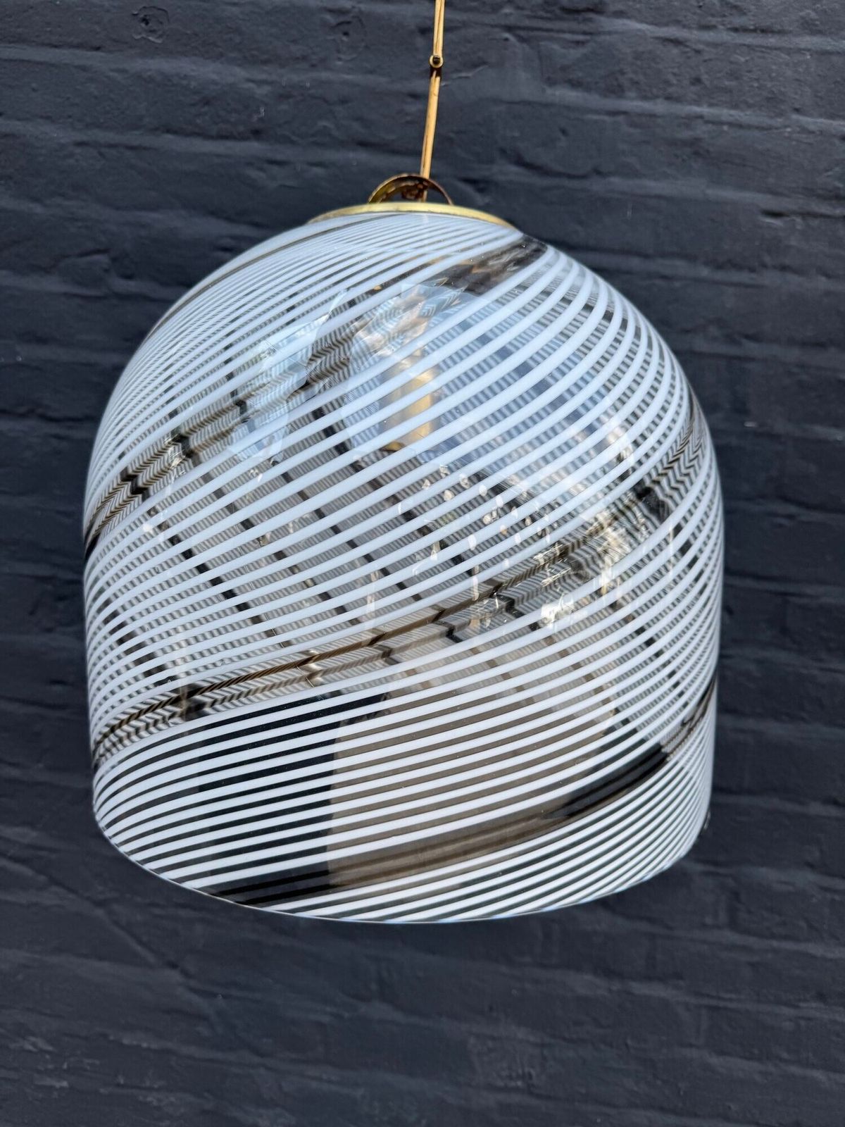 An Italian 1970s Large Murano Swirl Glass Pendant Light By Venini With Brass Top And Ceiling Rose. photo furniture