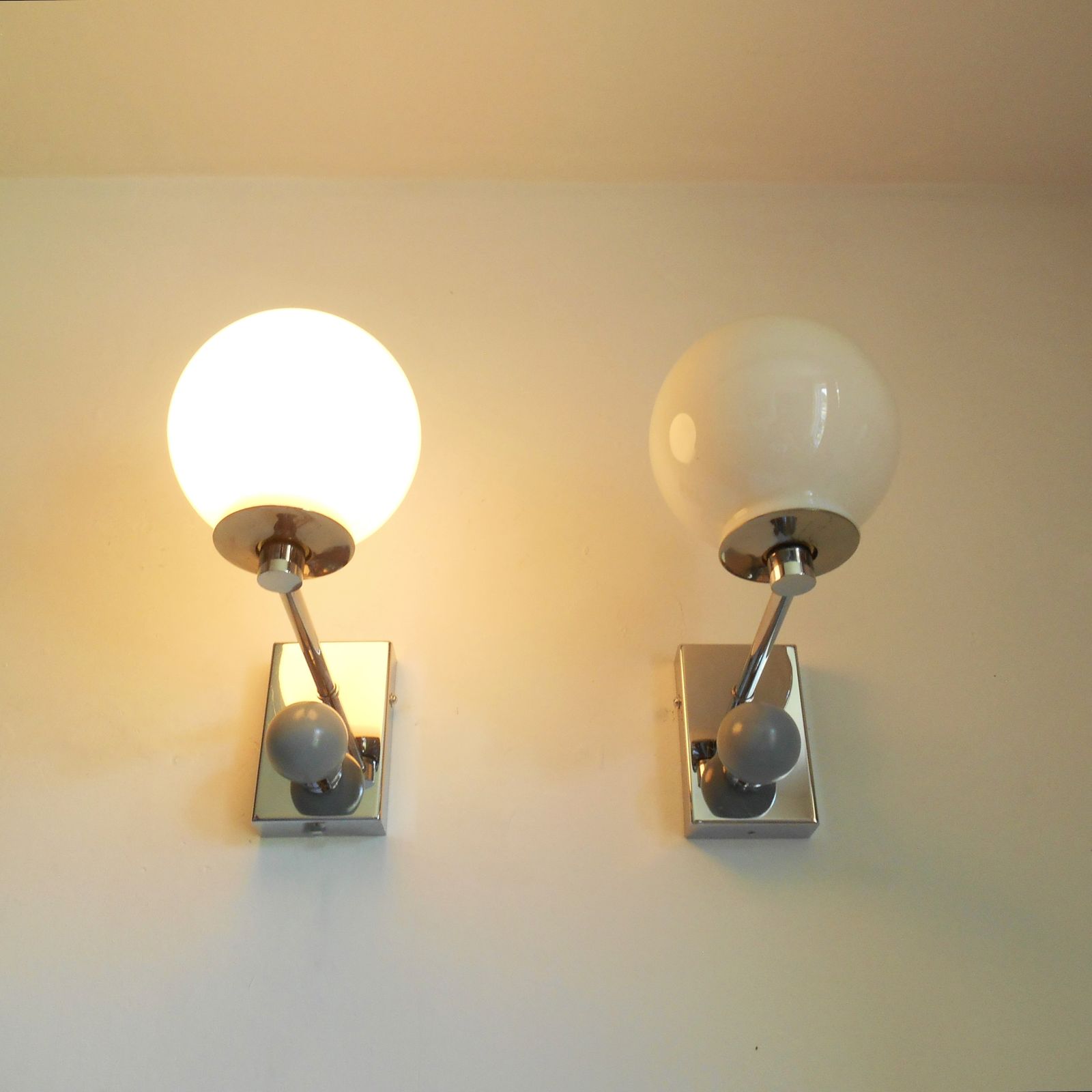 A Pair Of Unique Silver Chrome Wall Lamps With White Glass Globe Shades photo 275.0