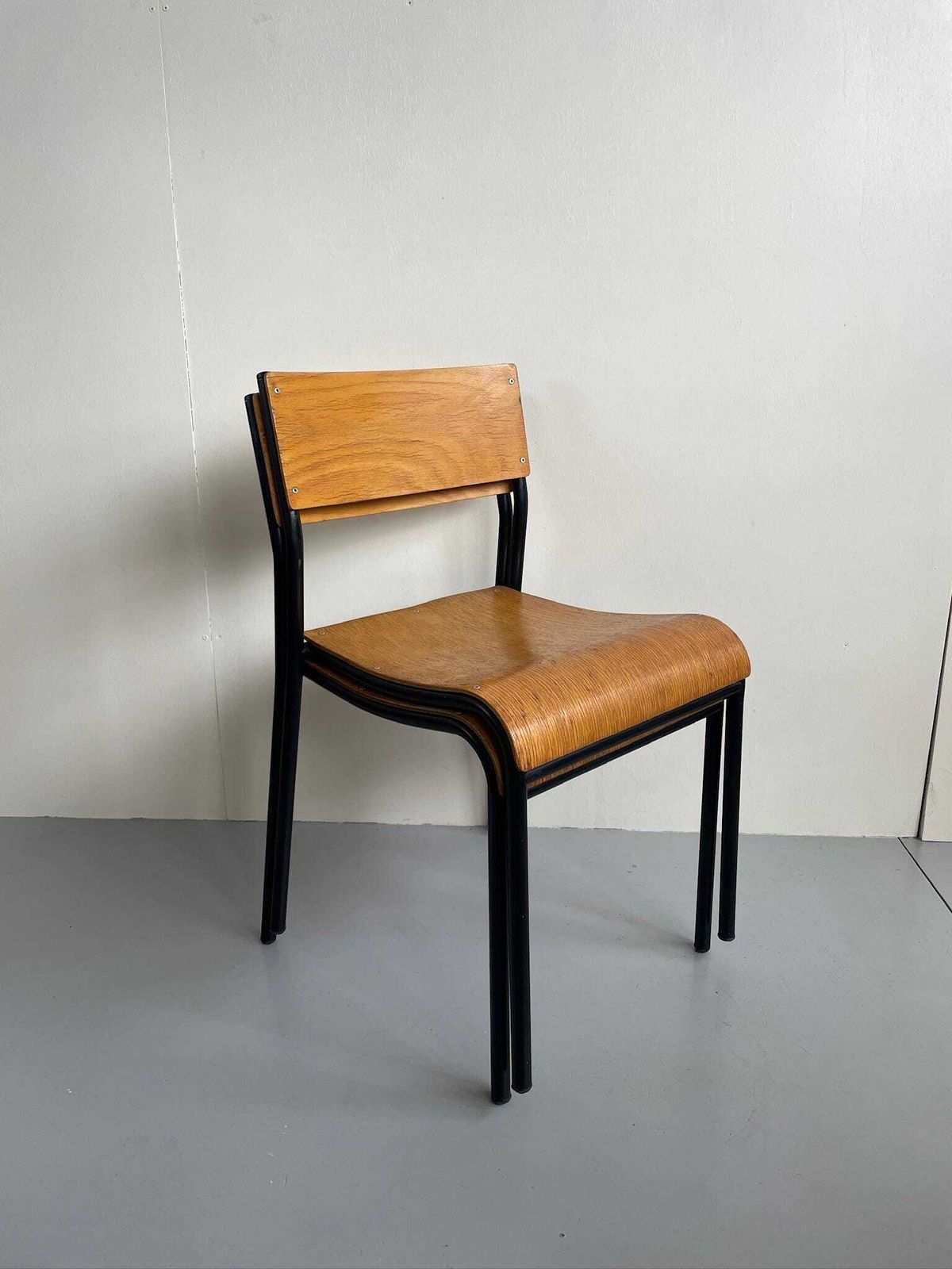 Pair Of Vintage Industrial Metal Stacking Dining Chairs With Bent Plywood Seats By Shepherd photo furniture