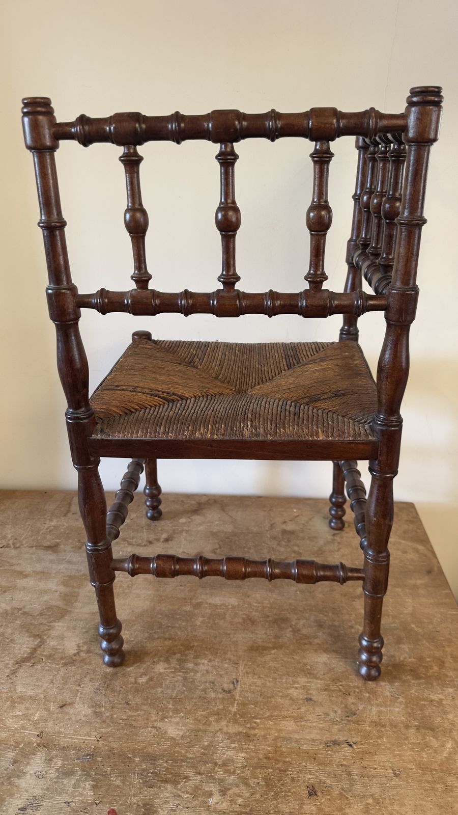 Vintage French Bobbin Corner Chair With A Woven Raffia Seat. photo furniture