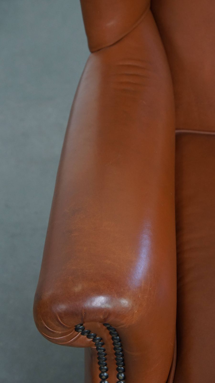 Stylish And In Good Condition Cognac Colored Cowhide Armchair In English Style With Decorative Nails photo buy