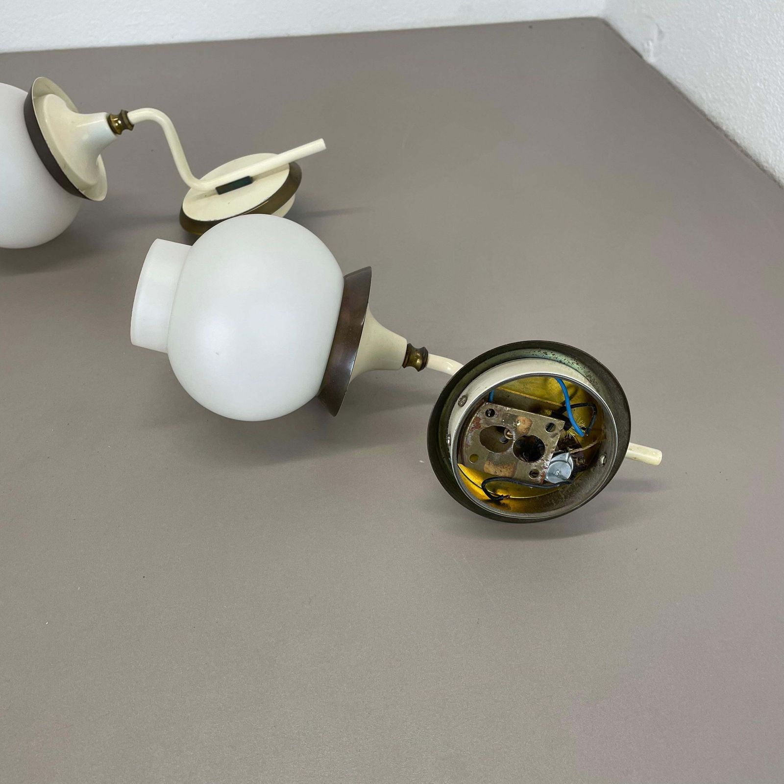 650.0 Set Of Two Brutalist Brass And White Glass Wall Light Sconces, France 1960s photo