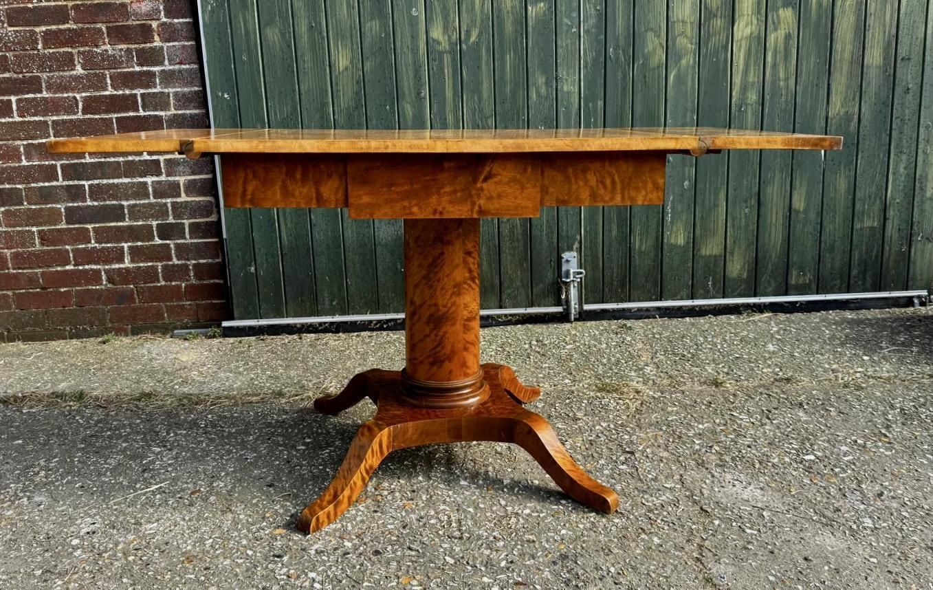 Swedish Biedermeier Drop Leaf Pedestal Table Golden Birch Tiger Stripe A photo for sale
