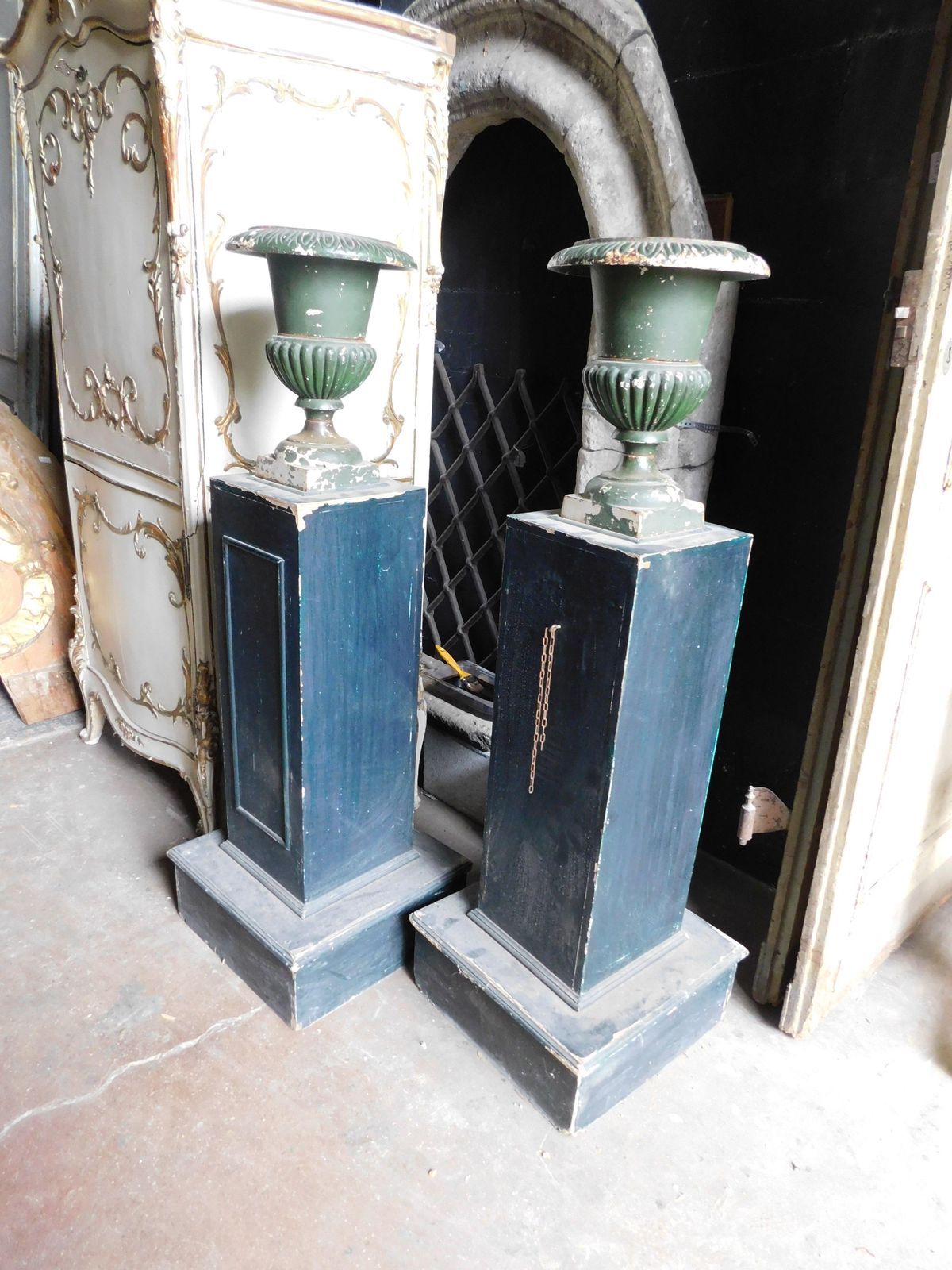 Pair Of Wooden Pillars With Attached Cast Iron Vases, Italy photo for sale