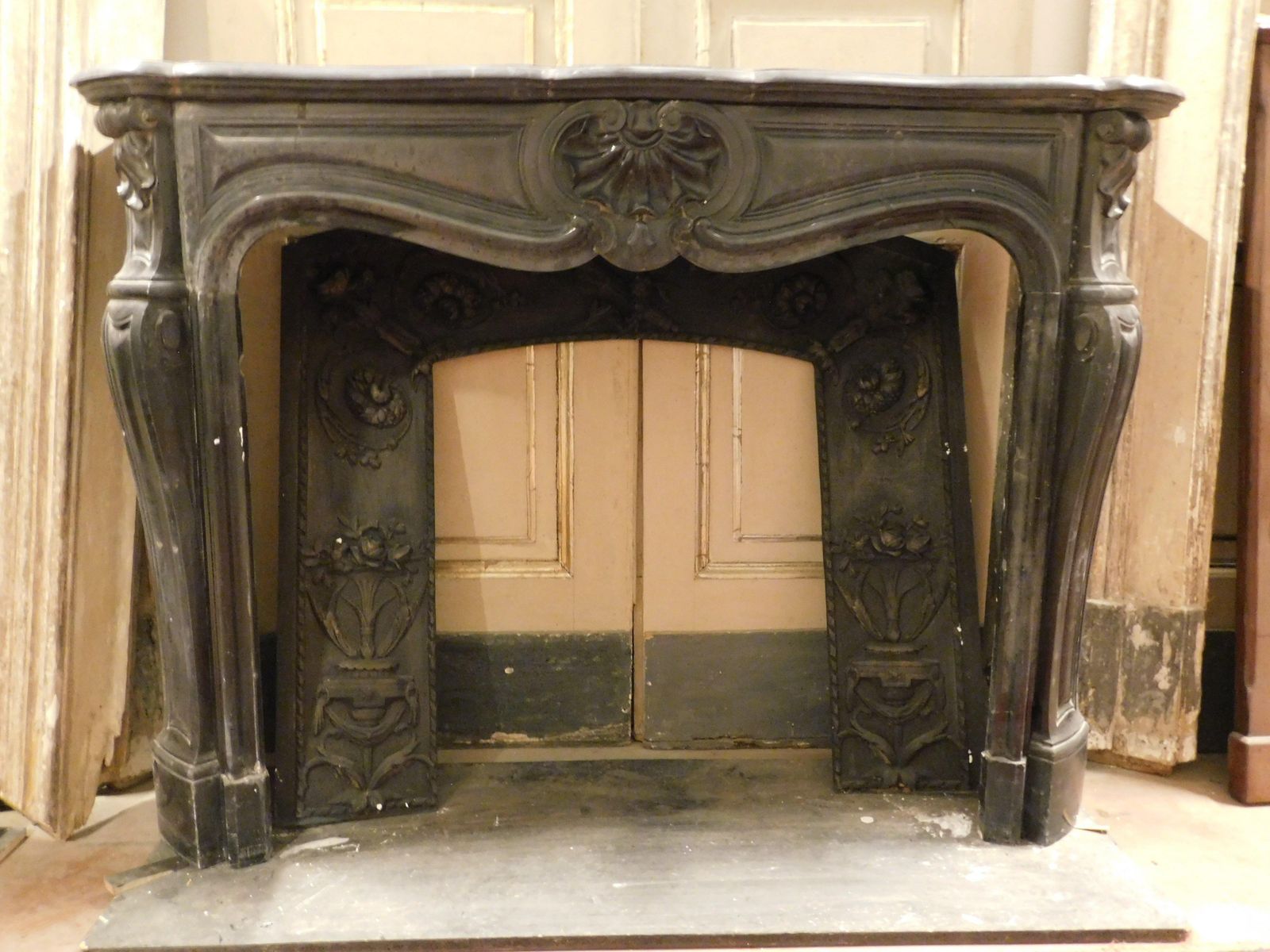 photo furniture Mantle Fireplace In Black Belgian Marble, Carved With Shells, France
