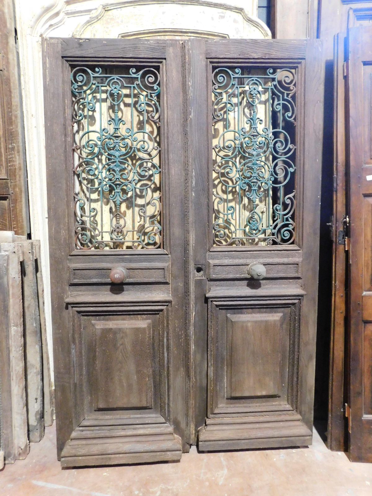 Entrance Door, Main Door In Oak Wood, Two Doors, With Green Iron Grille, Italy photo for sale