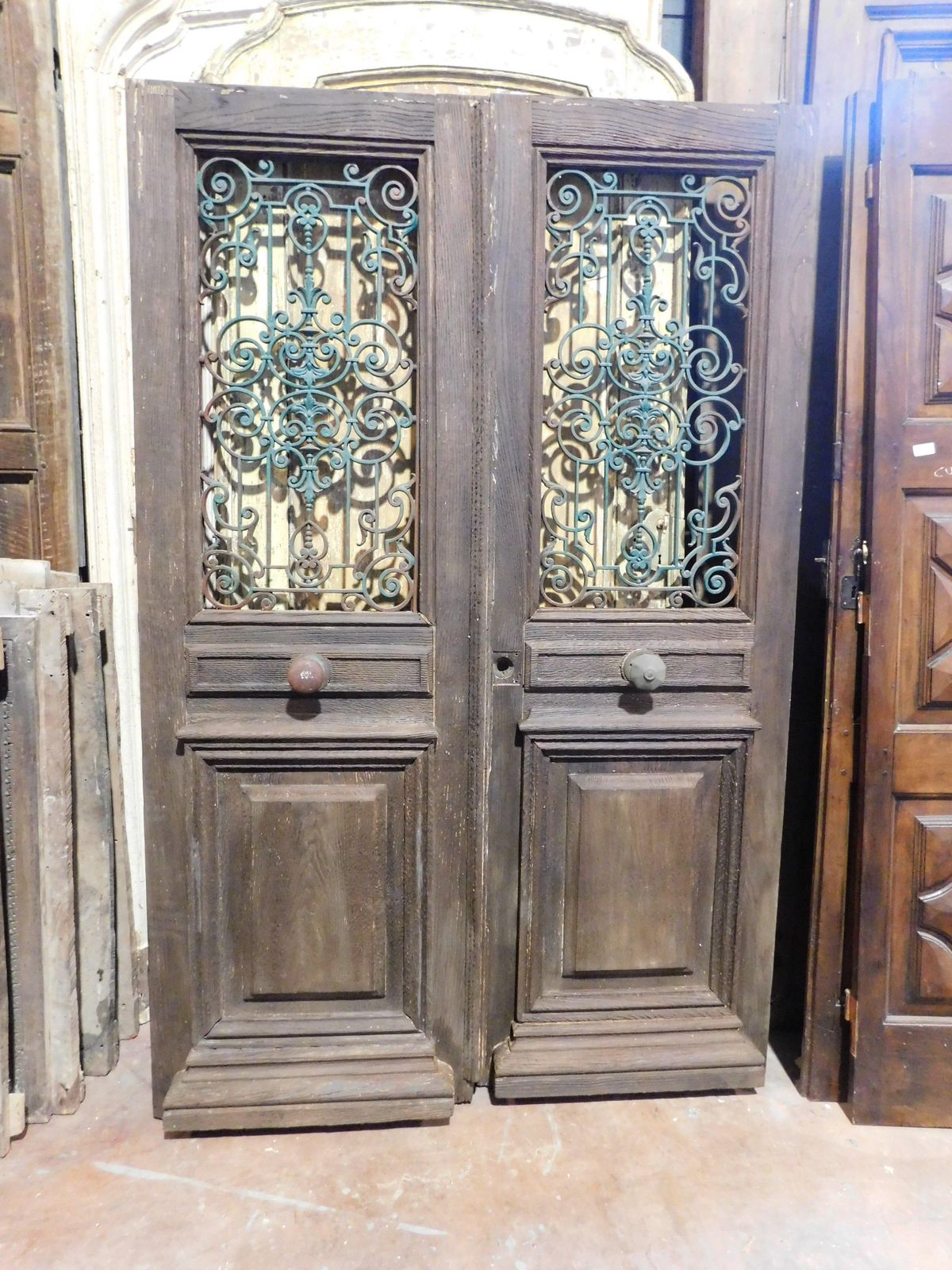 Entrance Door, Main Door In Oak Wood, Two Doors, With Green Iron Grille, Italy photo vinterior