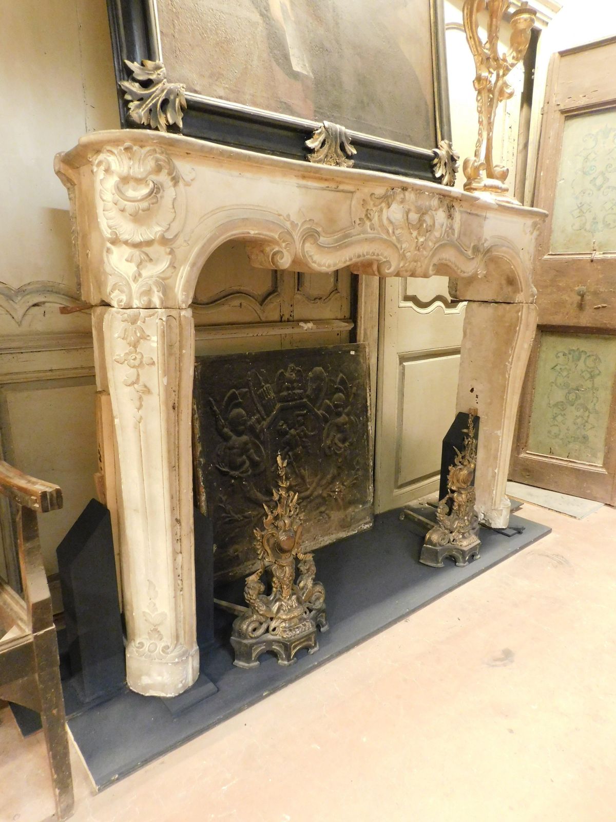 photo for sale Fireplace Mantle In Richly Carved Burgundy Stone And Wavy Shape, Italy