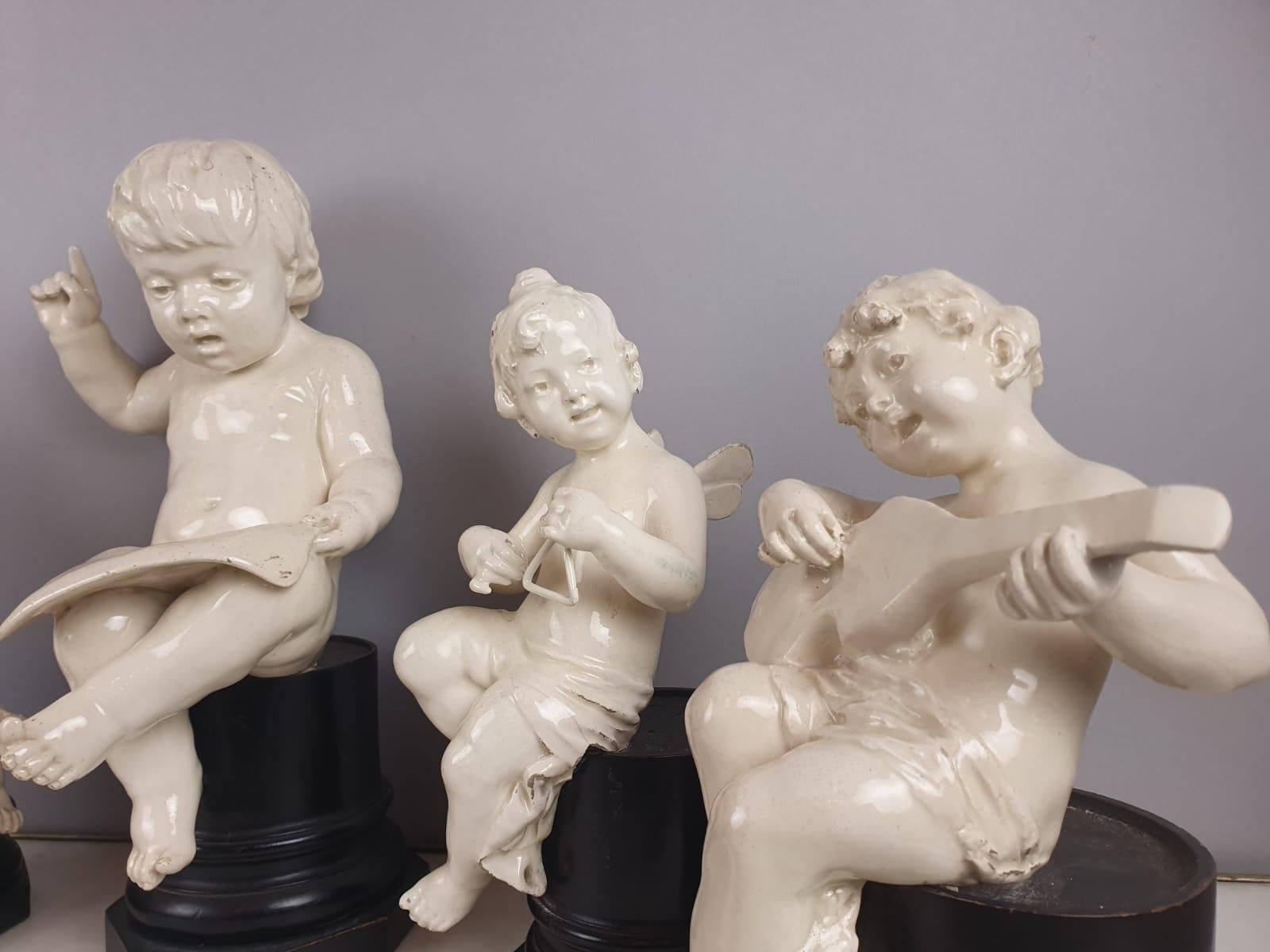 Group Of 5 Earthenware Musician Cherubs, Late 19th, Early 20th. photo for sale