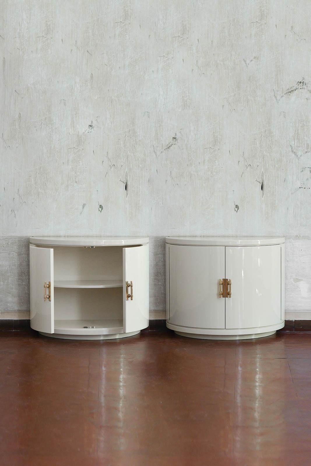 Pair Of Ivory Lacquered Half Moon Sideboards With Brass Details, 1930s. photo for sale