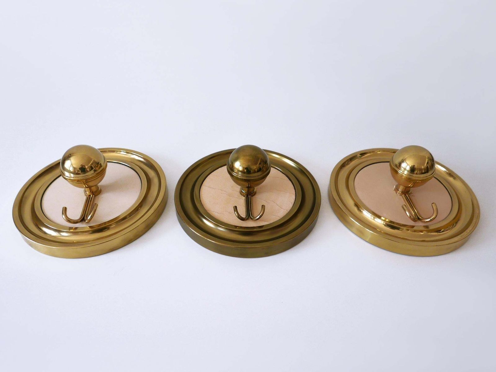 photo vintage Set Of Three Large Mid Century Modern Brass Coat Hooks Or Wall Wardrobes 1960s