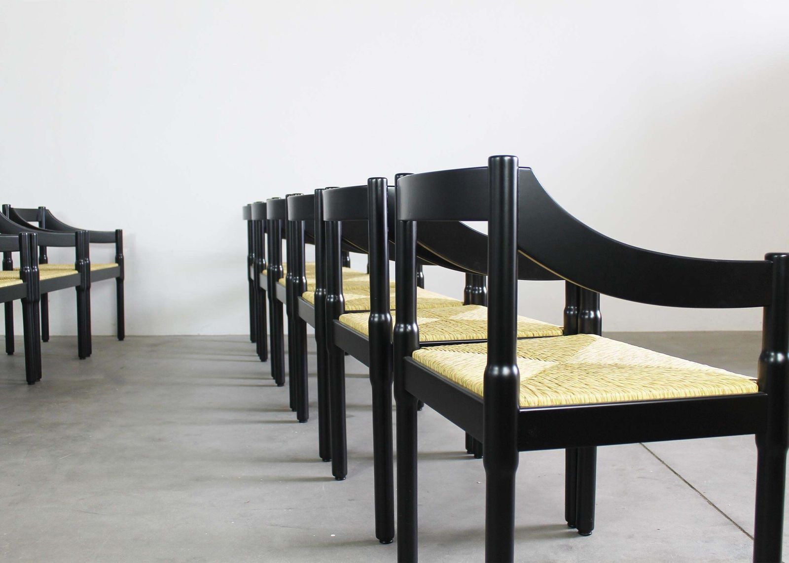 photo furniture Vico Magistretti Set Of Twelve Black Carimate Chairs By Cassina 1960s