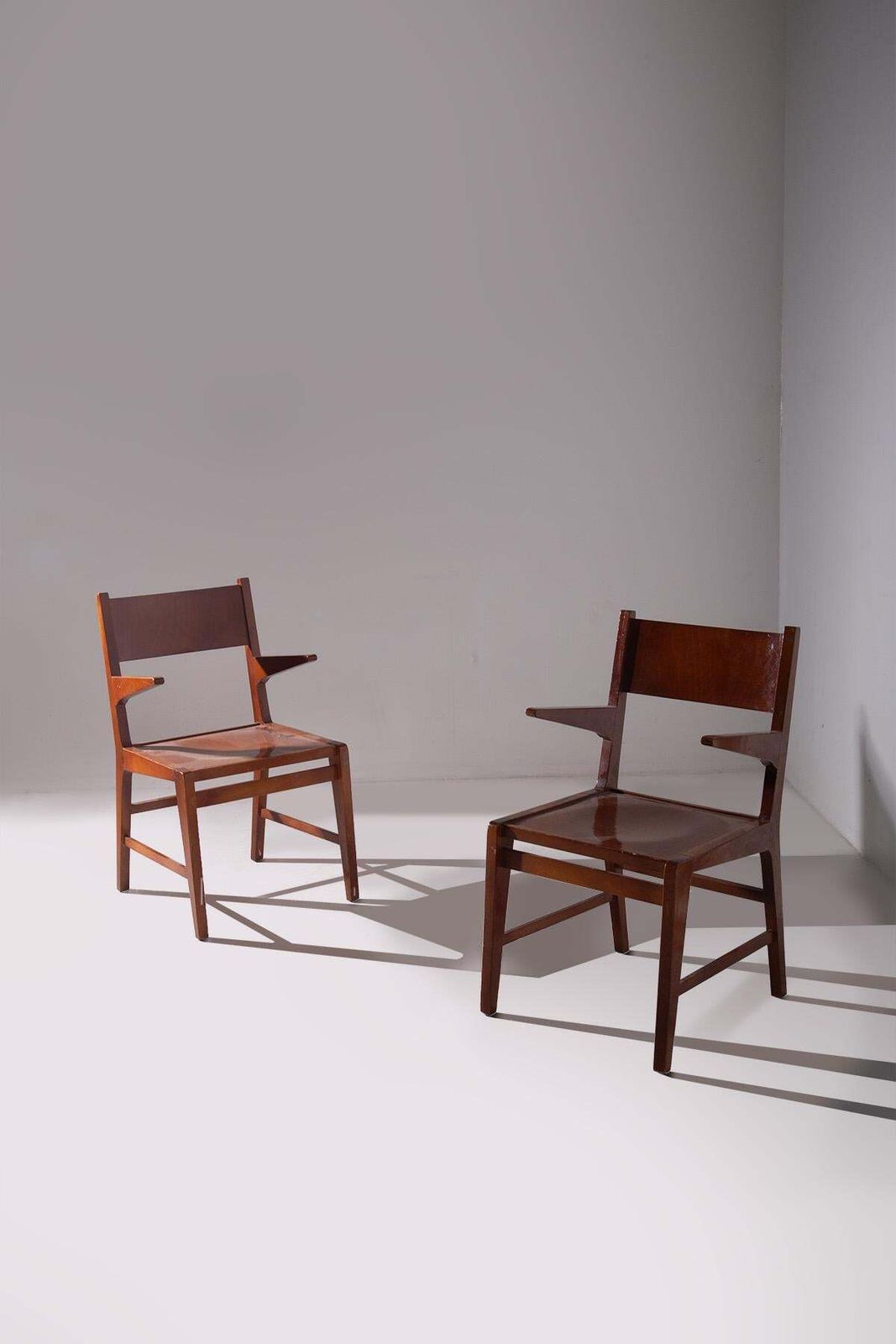 photo furniture Pair Of Wooden Chairs With Armrests