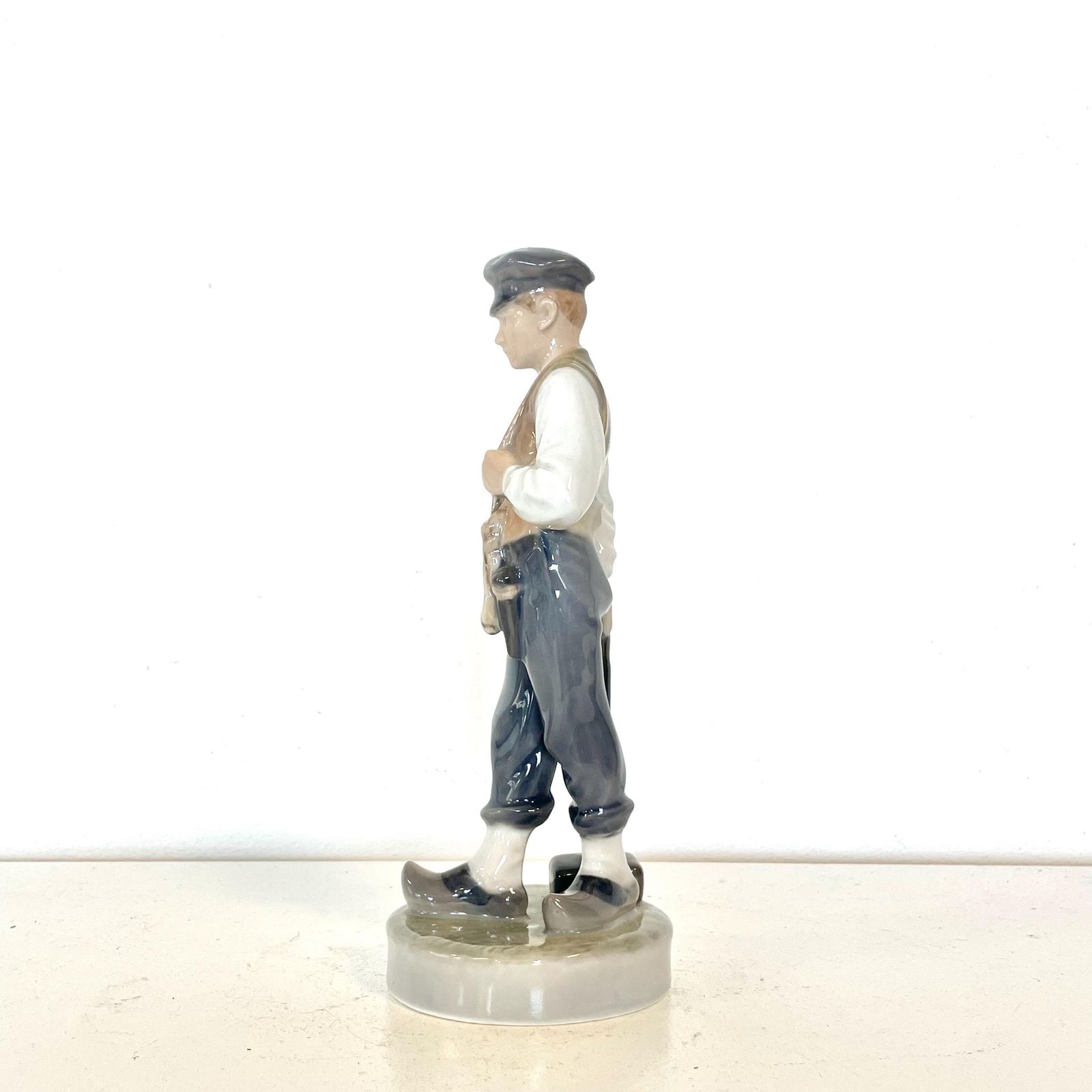 Royal Copenhagen Porcelain Figurine Of Boy Sentry With Hammet In Exquisite Glaze Designed By Christian Thomsen In 1904 photo for sale