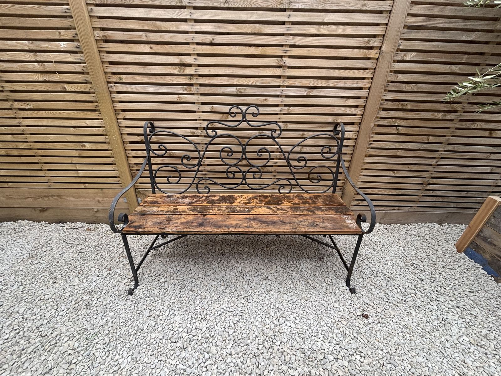 French Wrought Iron Garden Bench With Weathered Wooden Seat photo furniture