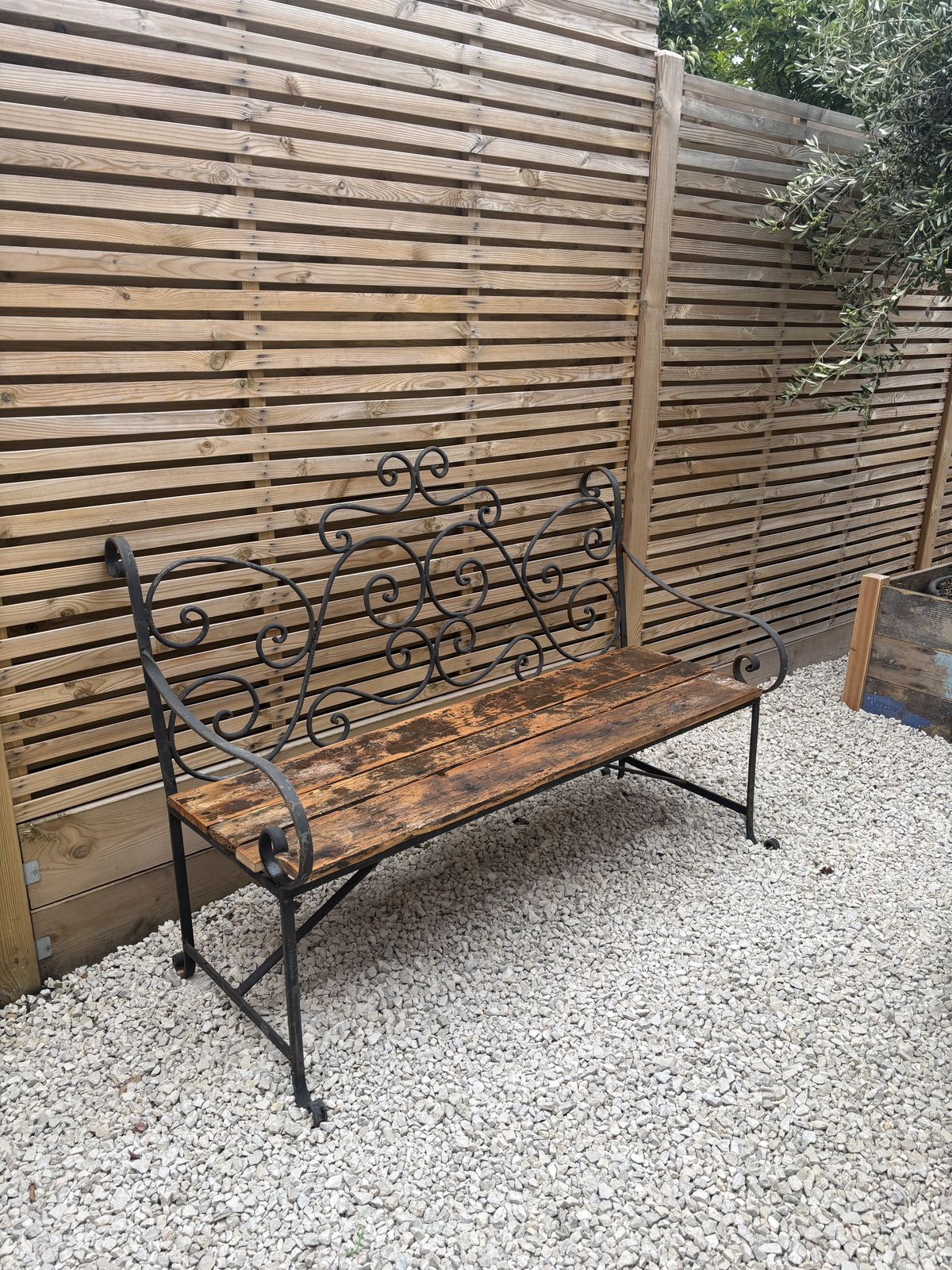French Wrought Iron Garden Bench With Weathered Wooden Seat photo for sale