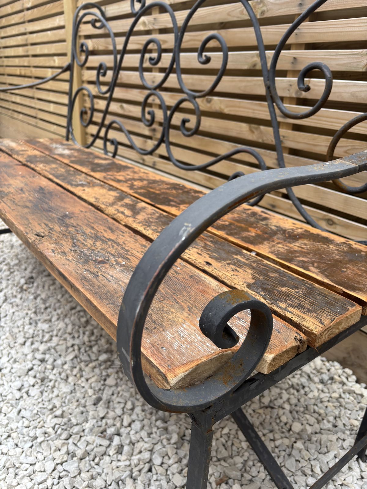 French Wrought Iron Garden Bench With Weathered Wooden Seat photo Garden Furniture