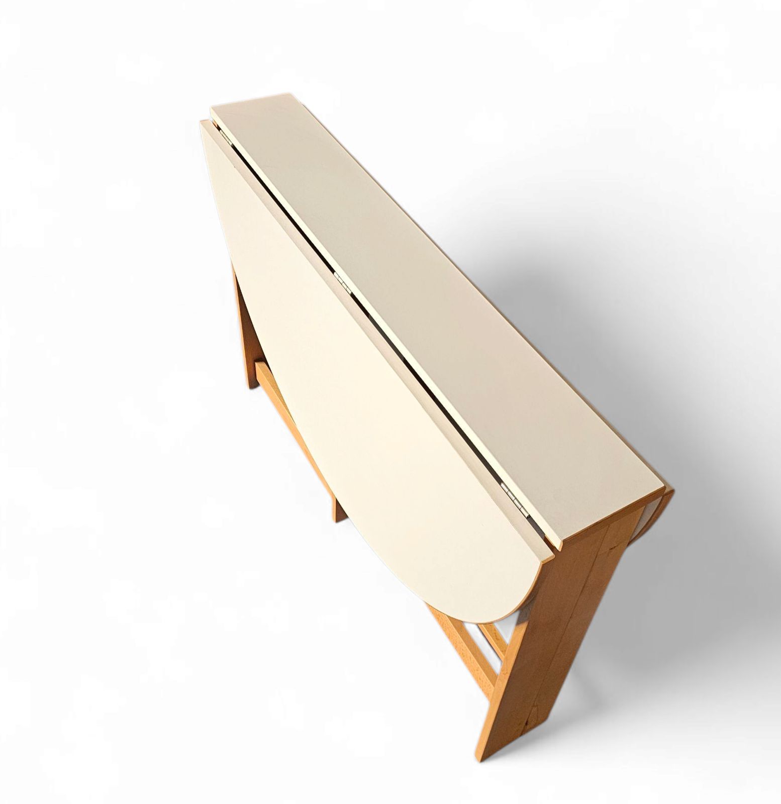 photo furniture Vintage Scandinavian Folding Dining Table With Side Leaves. The Oval Top Is Made Of White Formica