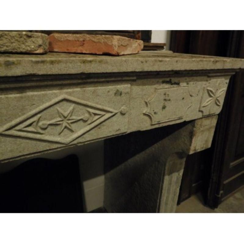 Fireplace Mantel Carved In Grey Stone With Decorations, France photo vinterior