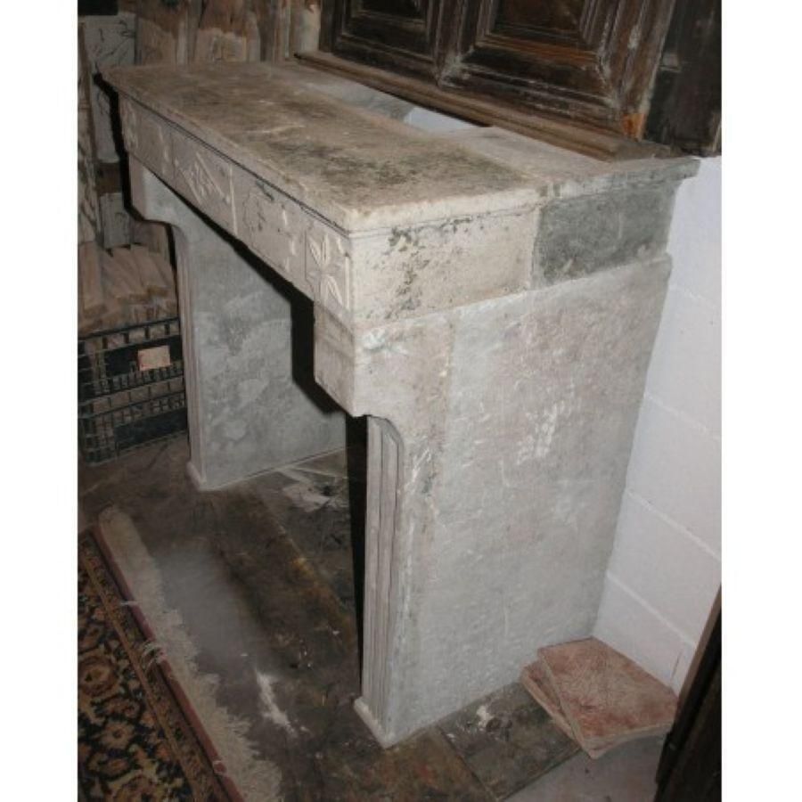 Fireplace Mantel Carved In Grey Stone With Decorations, France photo vintage