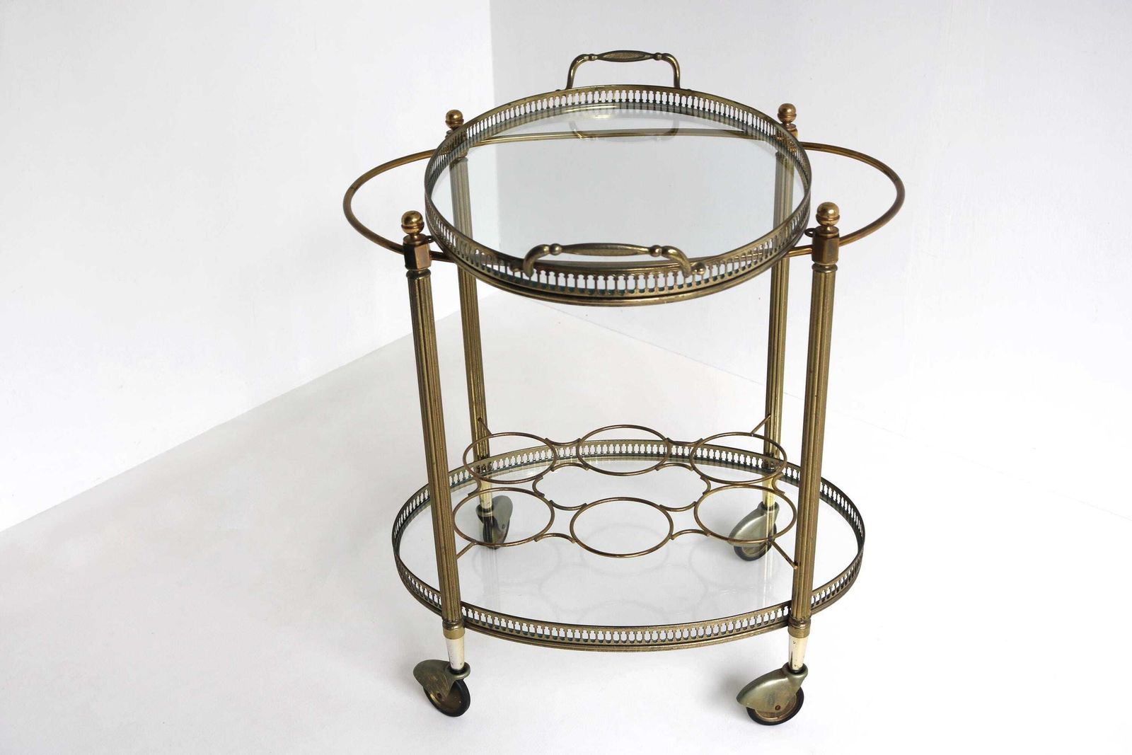 Vintage Gilt Metal Oval Bar Cart Hollywood Regency Glass Trolley Removable Tray & Bottle Rack In The Style Of Maison Jansen France Ca. 1940s photo for sale