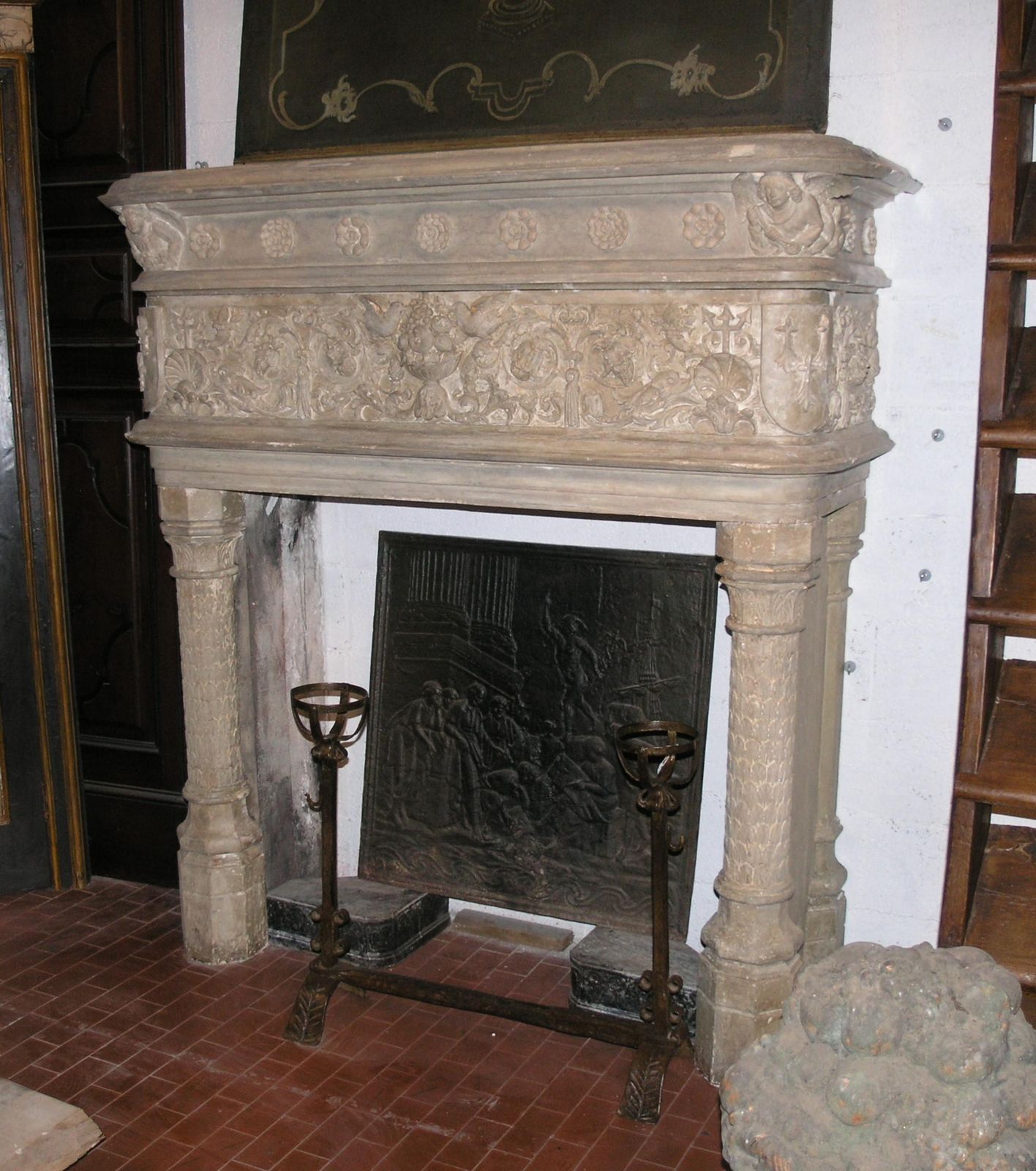 Fireplace Mantel In Gray Stone, Richly Carved With Birds, Flowers And Cherubs photo for sale