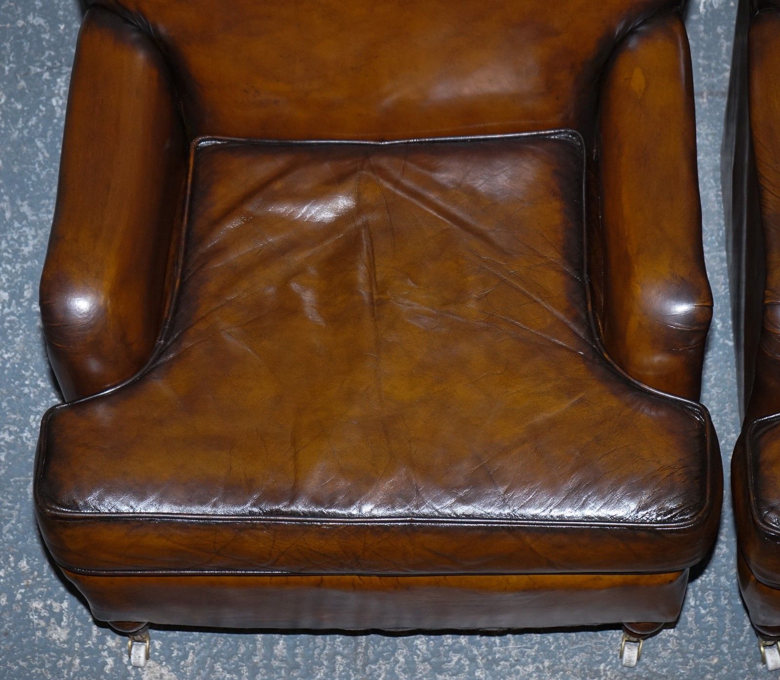 photo for sale Pair Of Cigar Hand Dyed Leather Howard & Sons Style Armchairs On Castor Feet